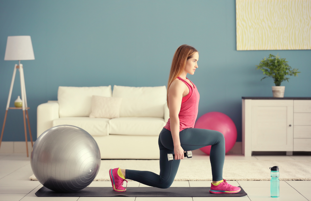 Women exercising at home. Performing a lunge with dumbbells