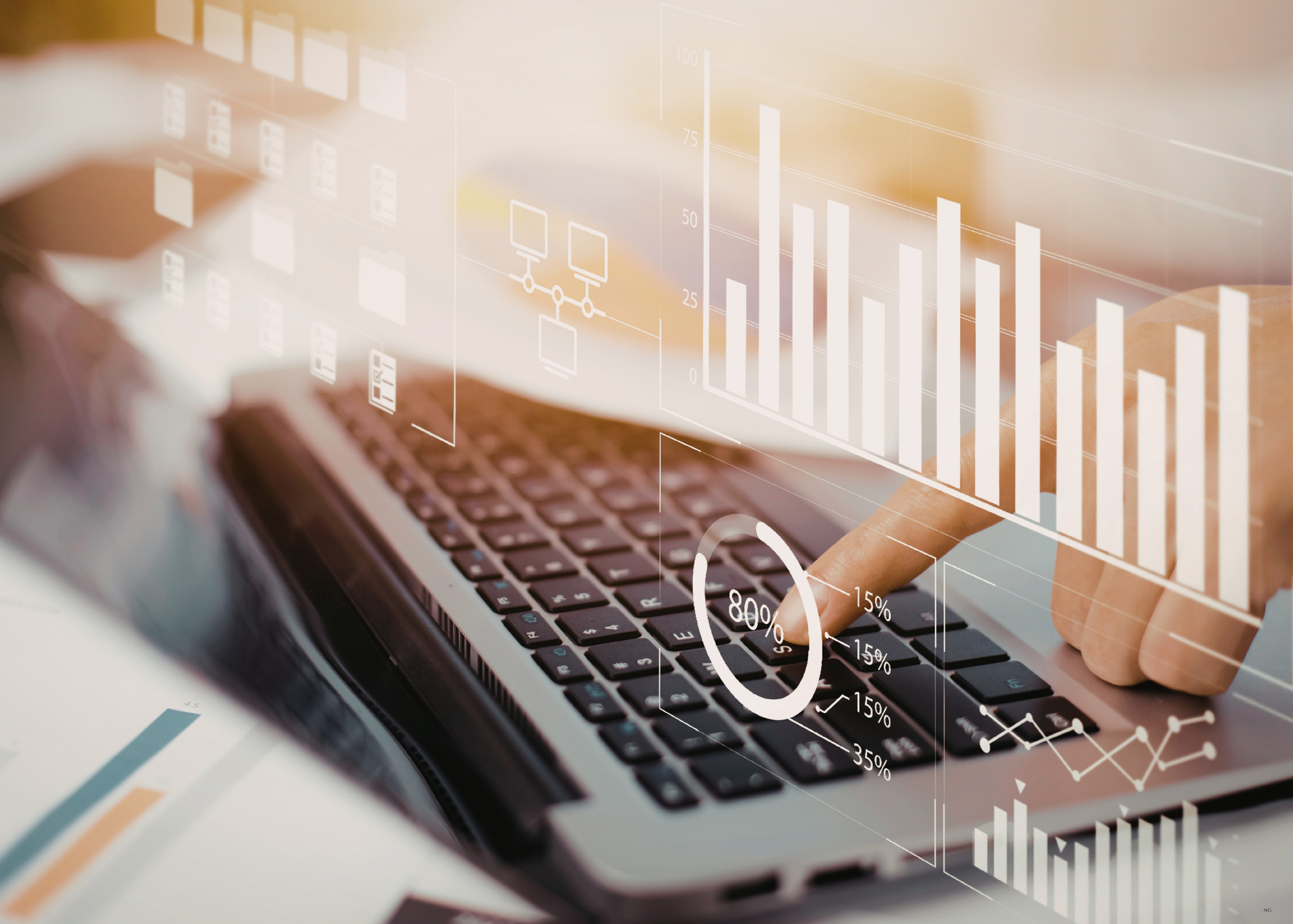A person's hand typing on a laptop with digital graphs, charts, and data overlays illustrating analytics and data visualization.