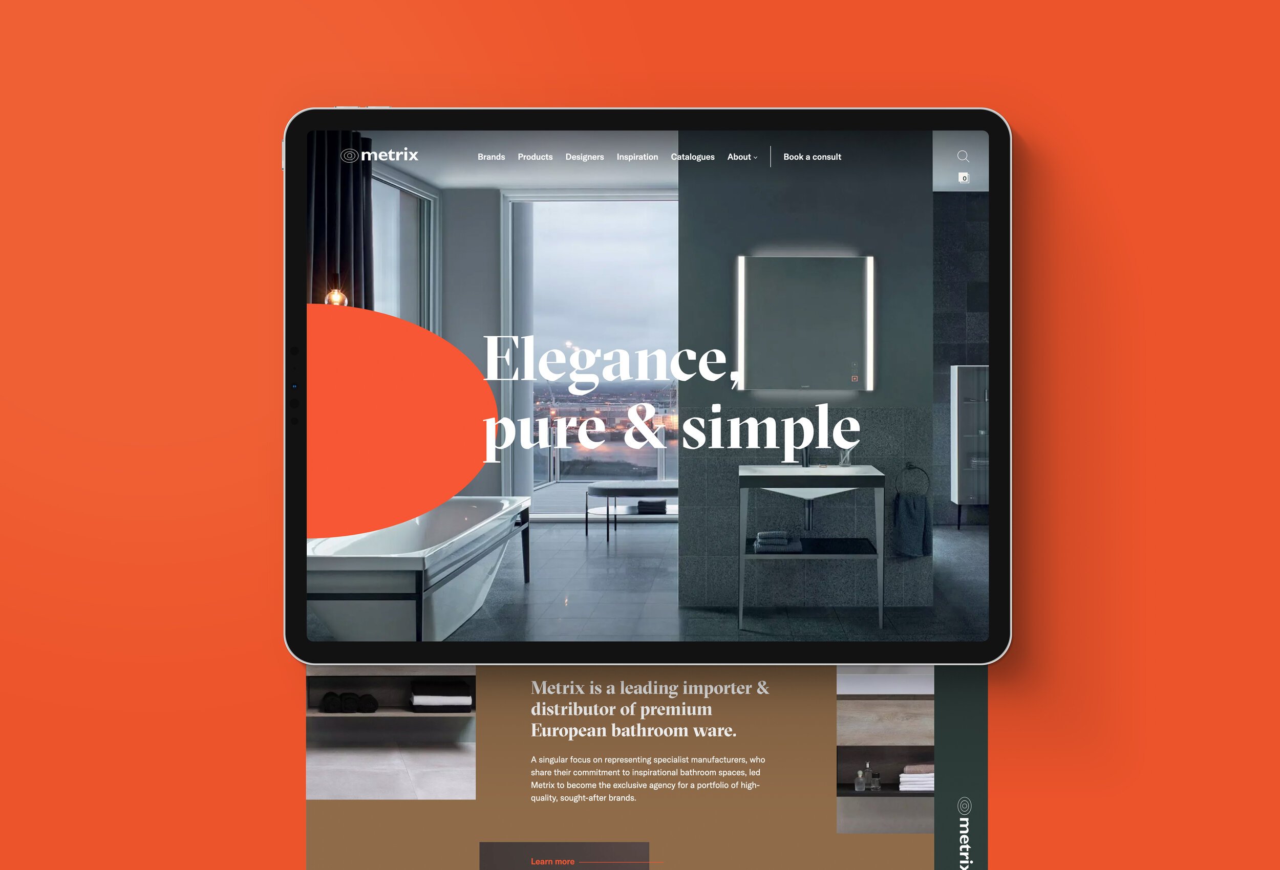 A screenshot of the Metrix website displayed on a computer monitor, showcasing modern bathroom designs with a focus on sleek, minimalist fixtures and decor.