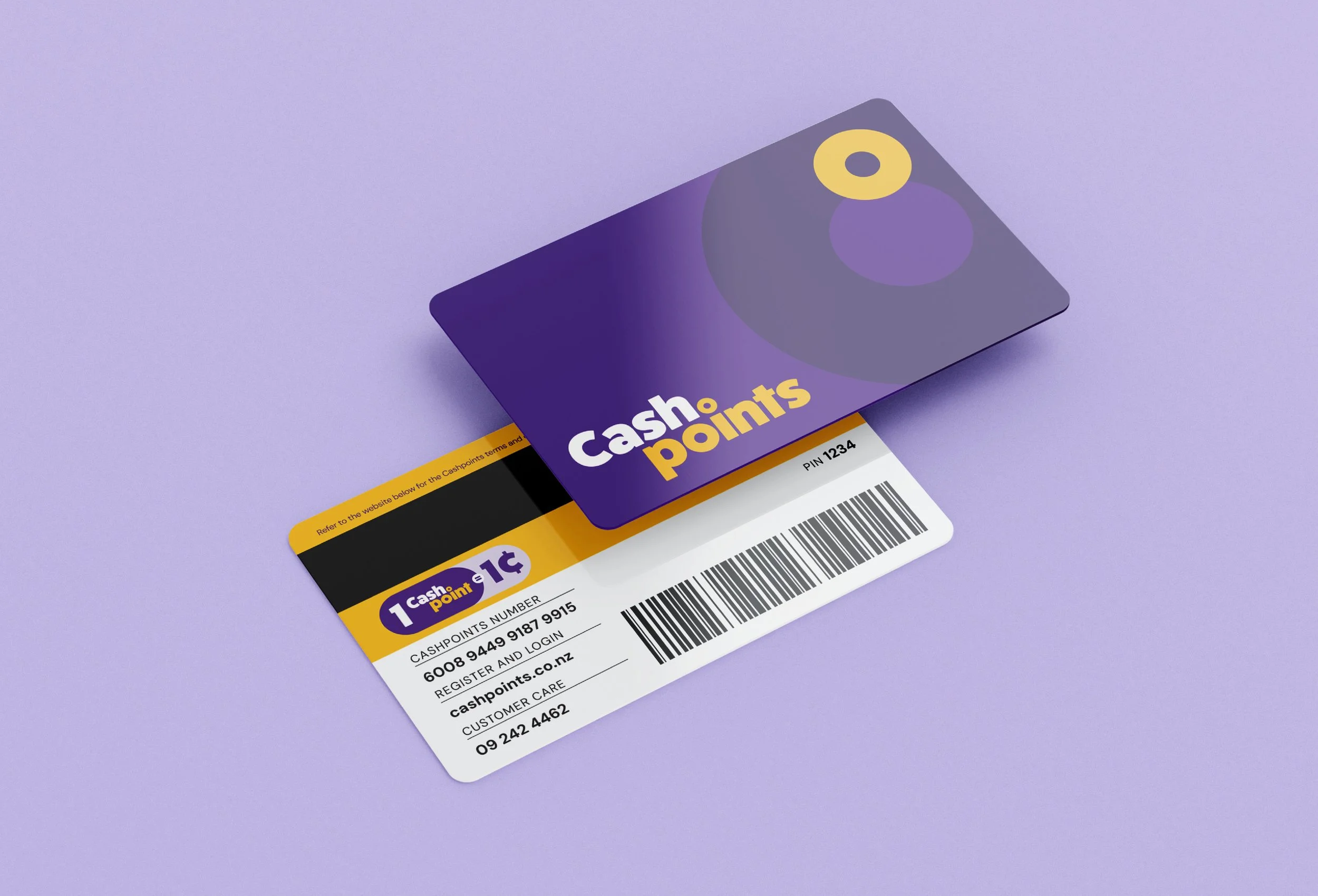 A purple and yellow cash points card and a receipt with barcodes, on a purple surface.