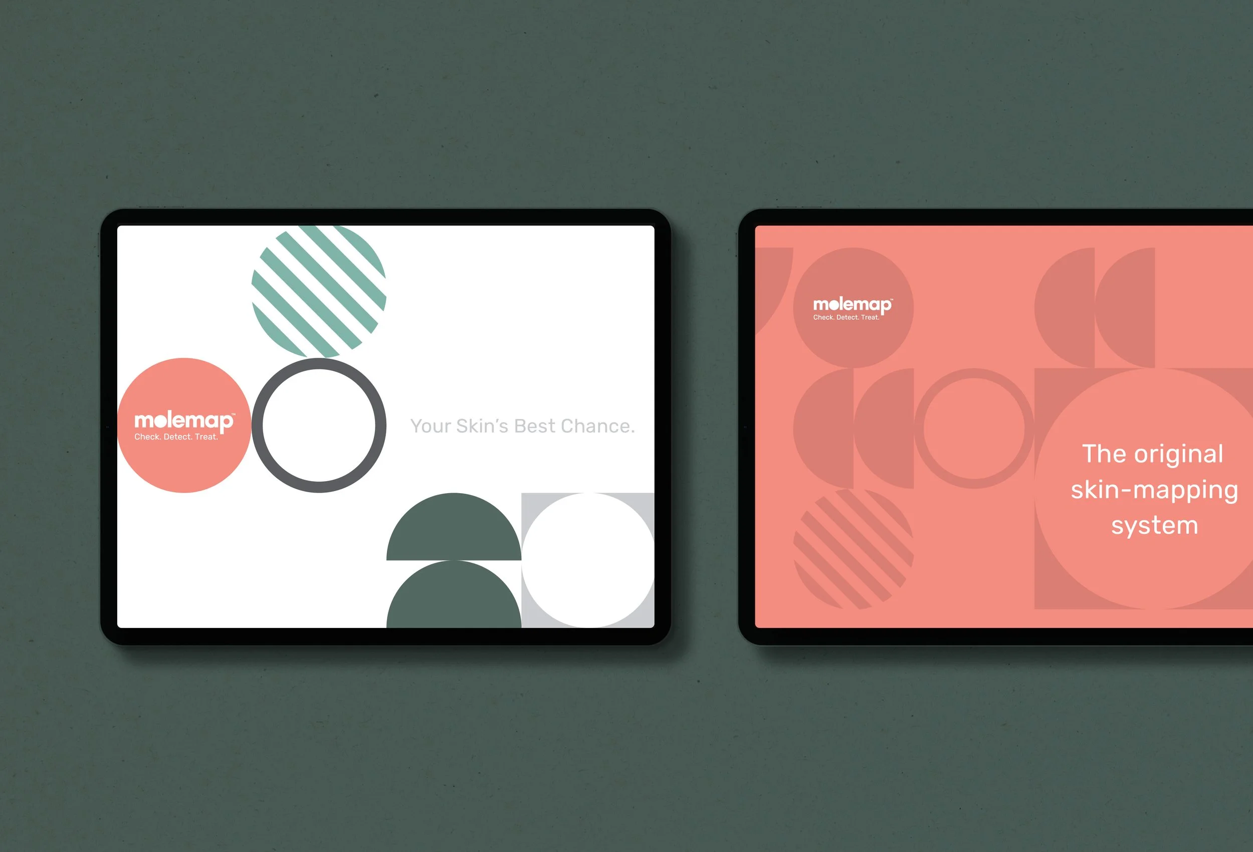 Two digital tablets displaying branding materials for Molemap, featuring minimalist designs with circular and line patterns, set on a green surface.