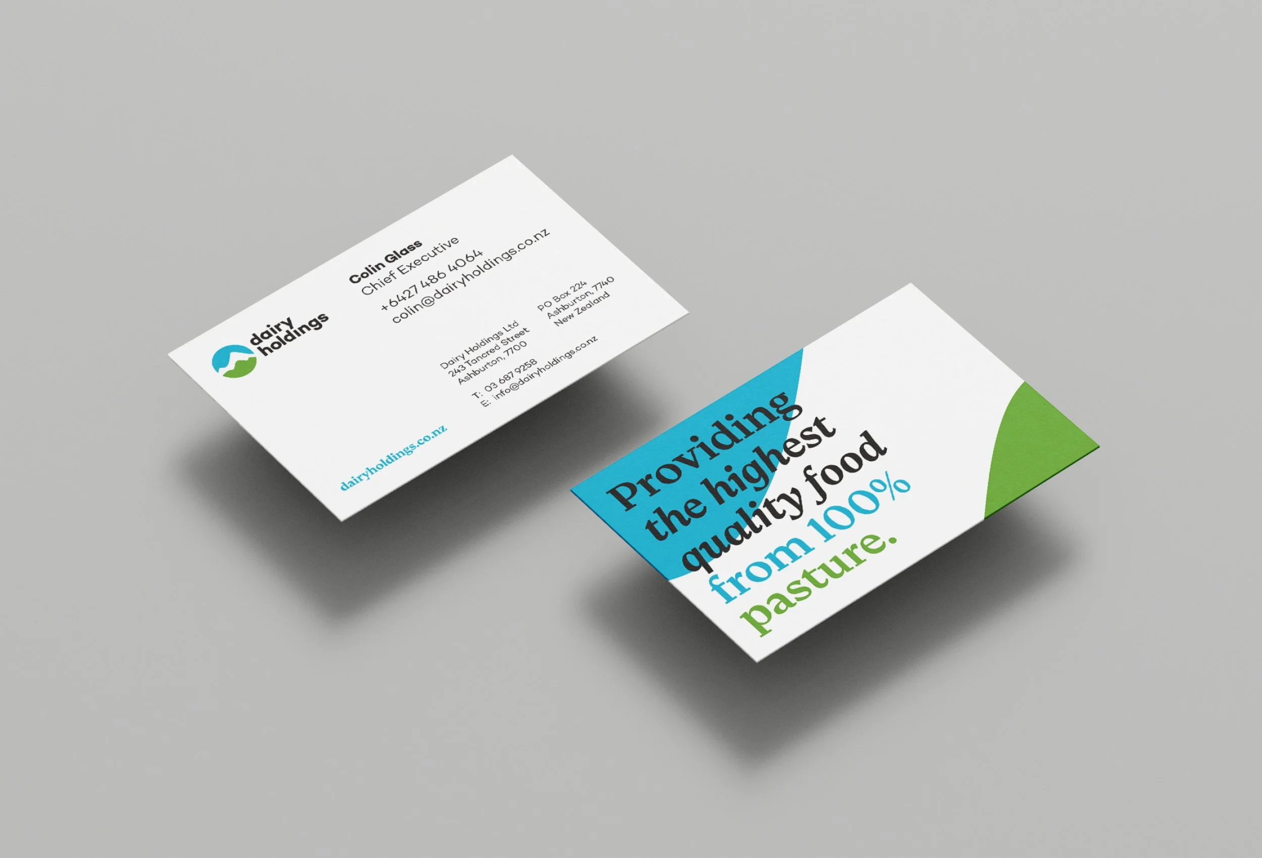 Business cards from Dairy Holdings, including contact details of Colin Glass and the company's logo which features a stylized blue and green icon.