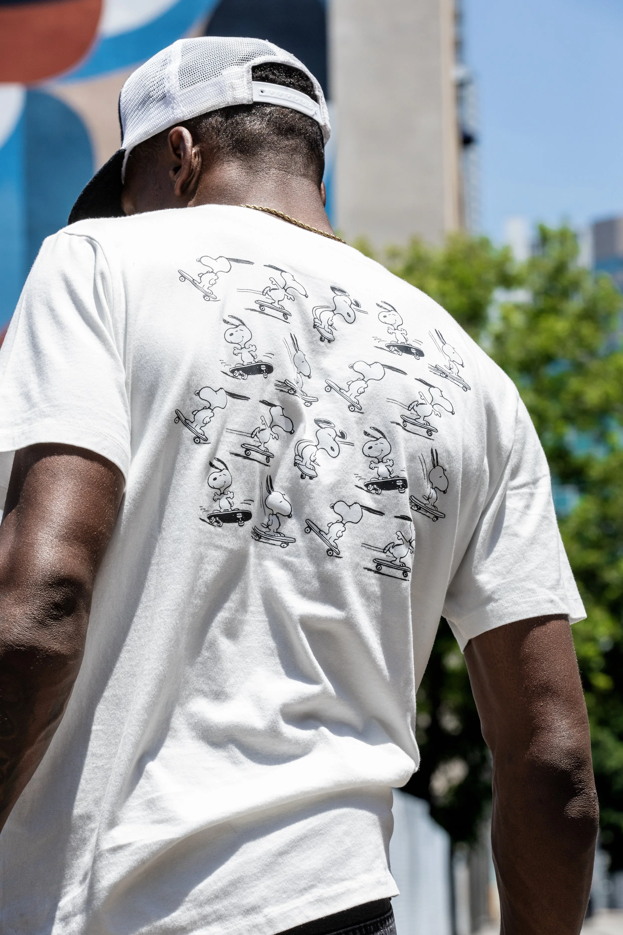 LeAndre wearing white Snoopy shirt portrait back 5.JPG