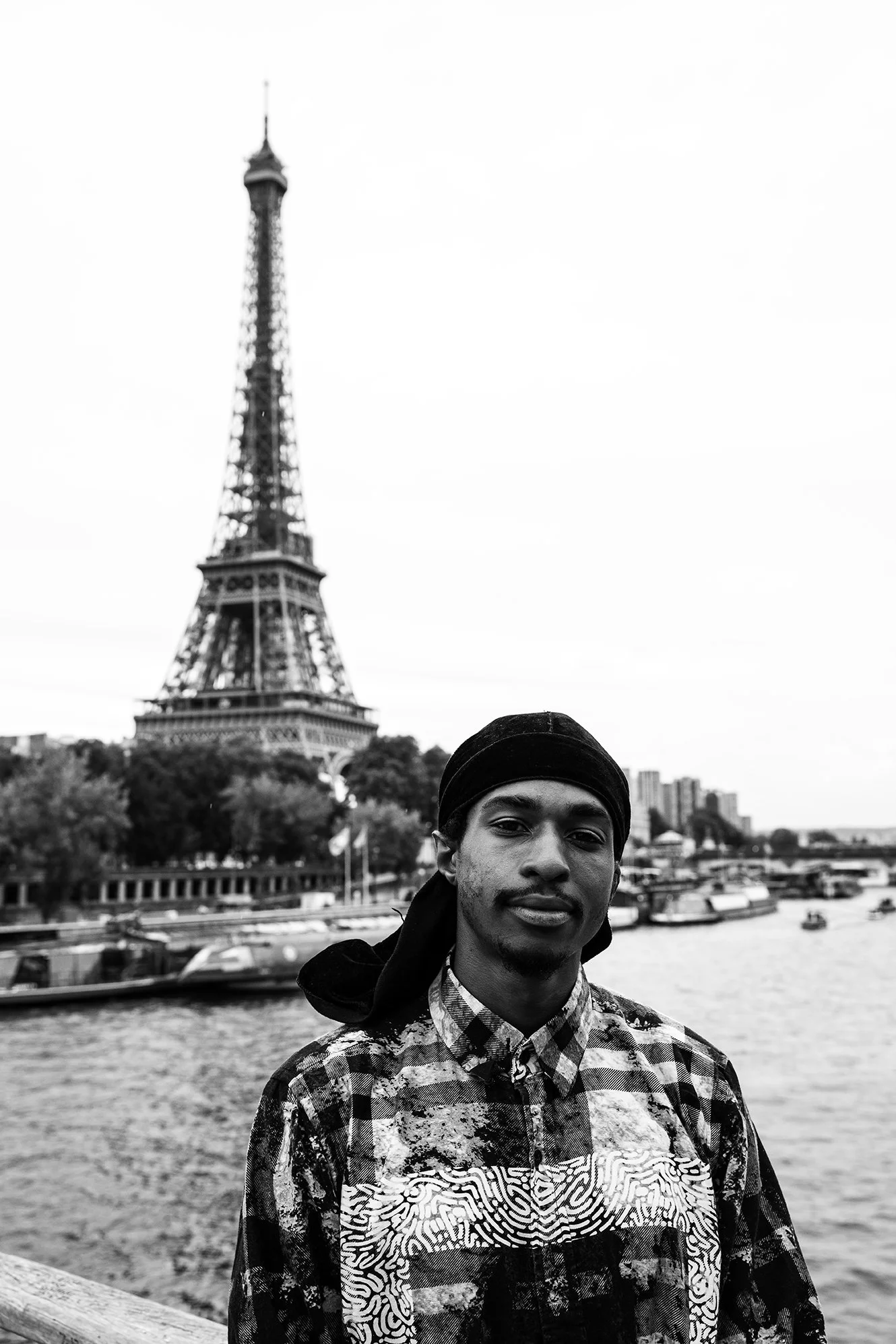 Chris in front of Eiffel tower portrait 3.jpg