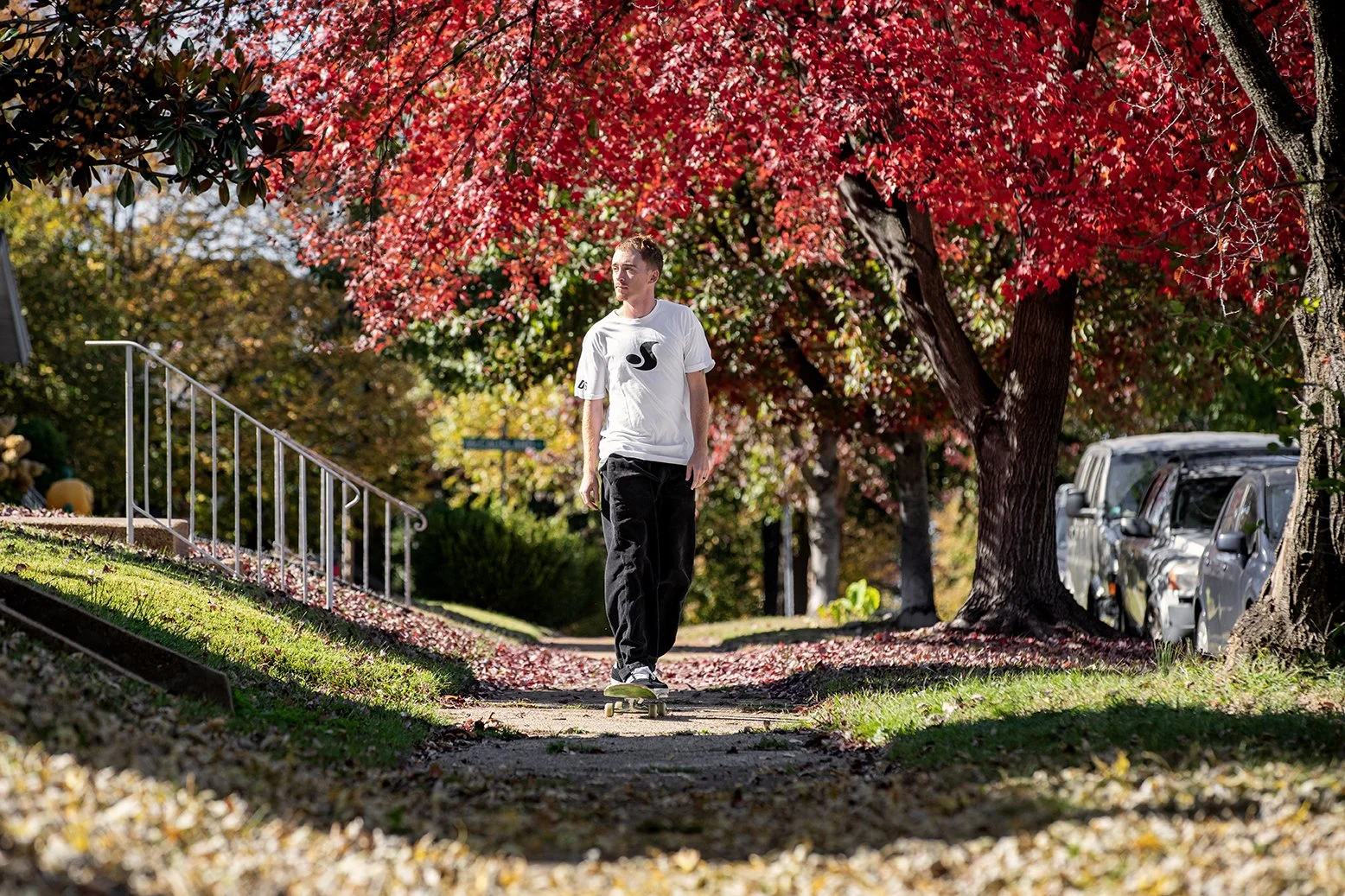 Tyler riding down sidewalk.jpg