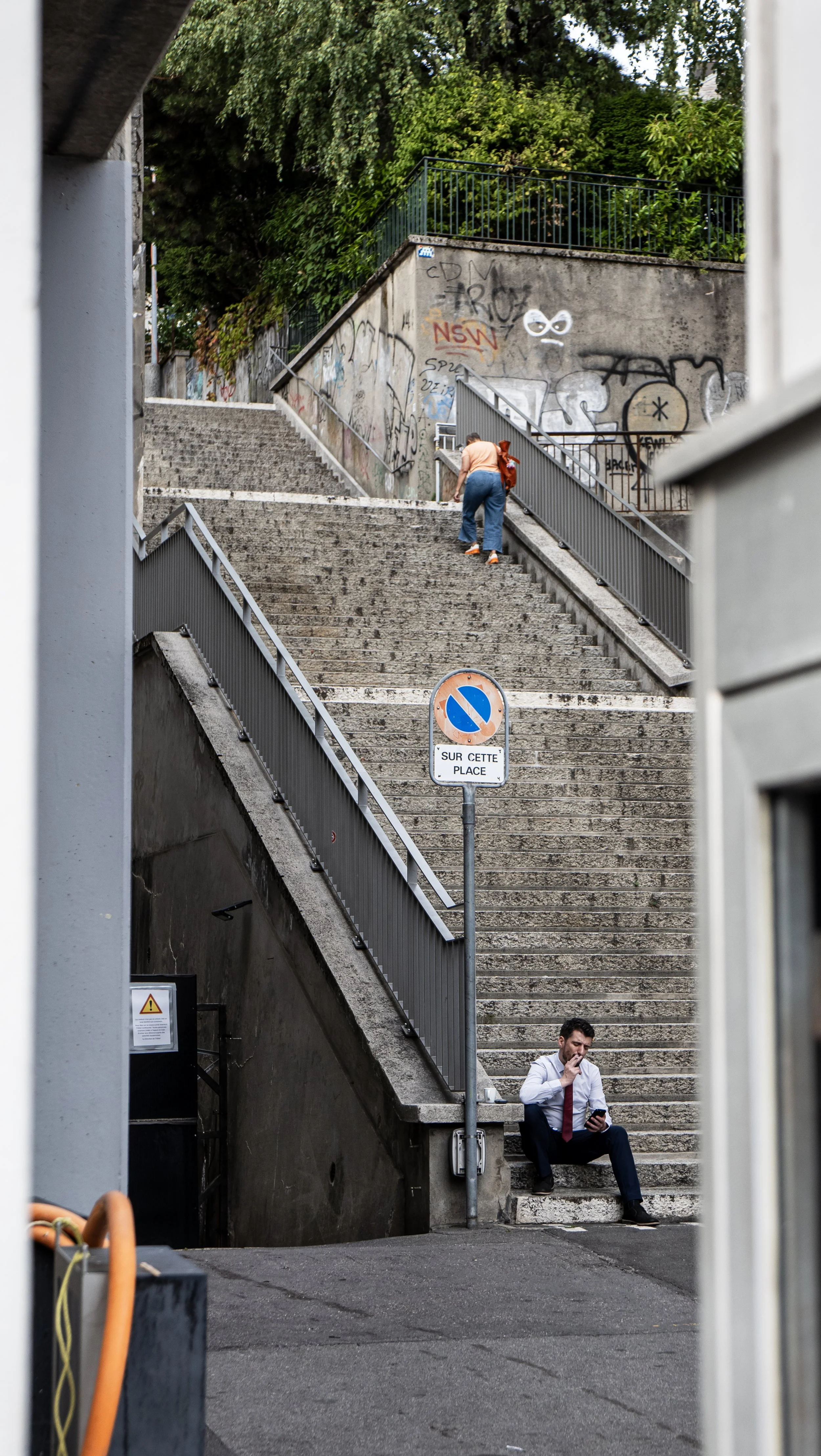 Guy smoking cigarette on stairs.JPG