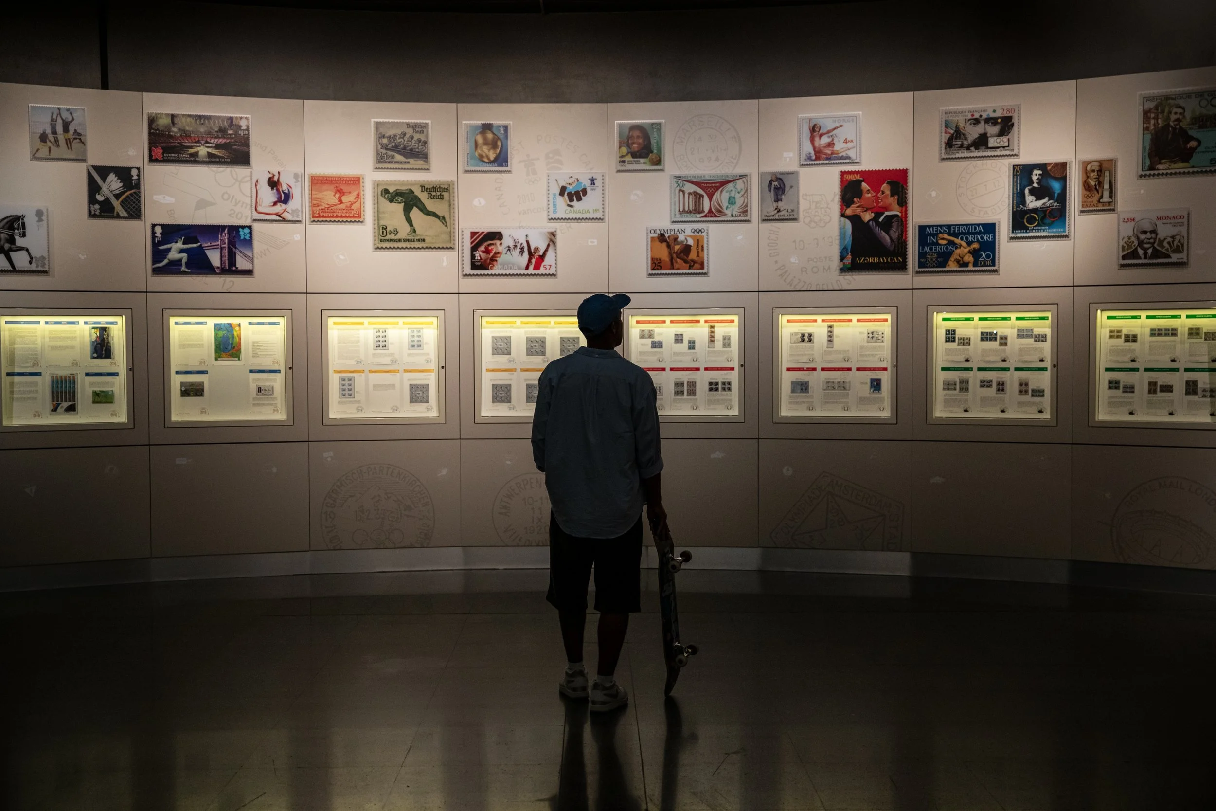 Koston looking at wall at Olympic museum.JPG