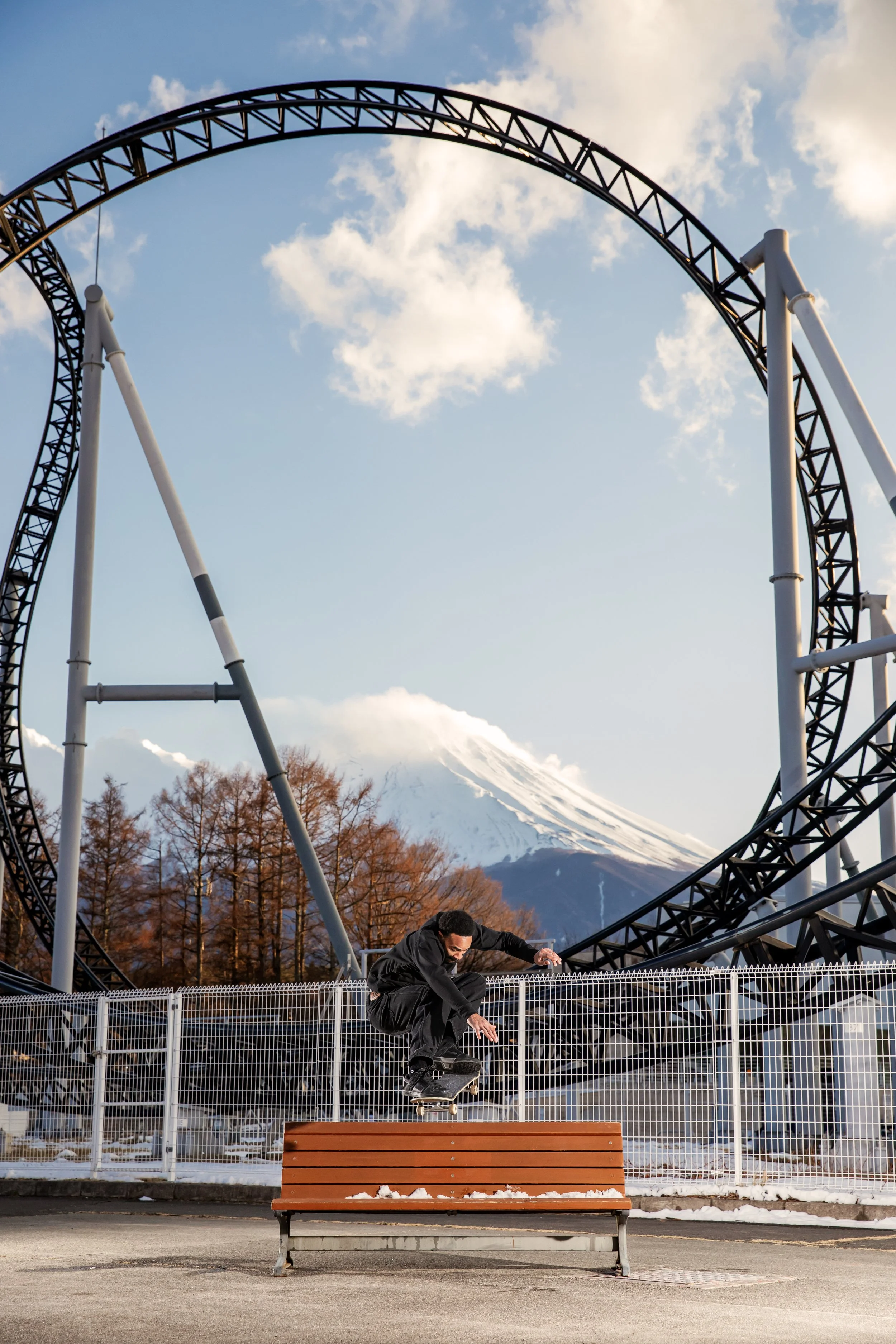 Timmy ollie over bench by rollercoaster (vertical).JPG