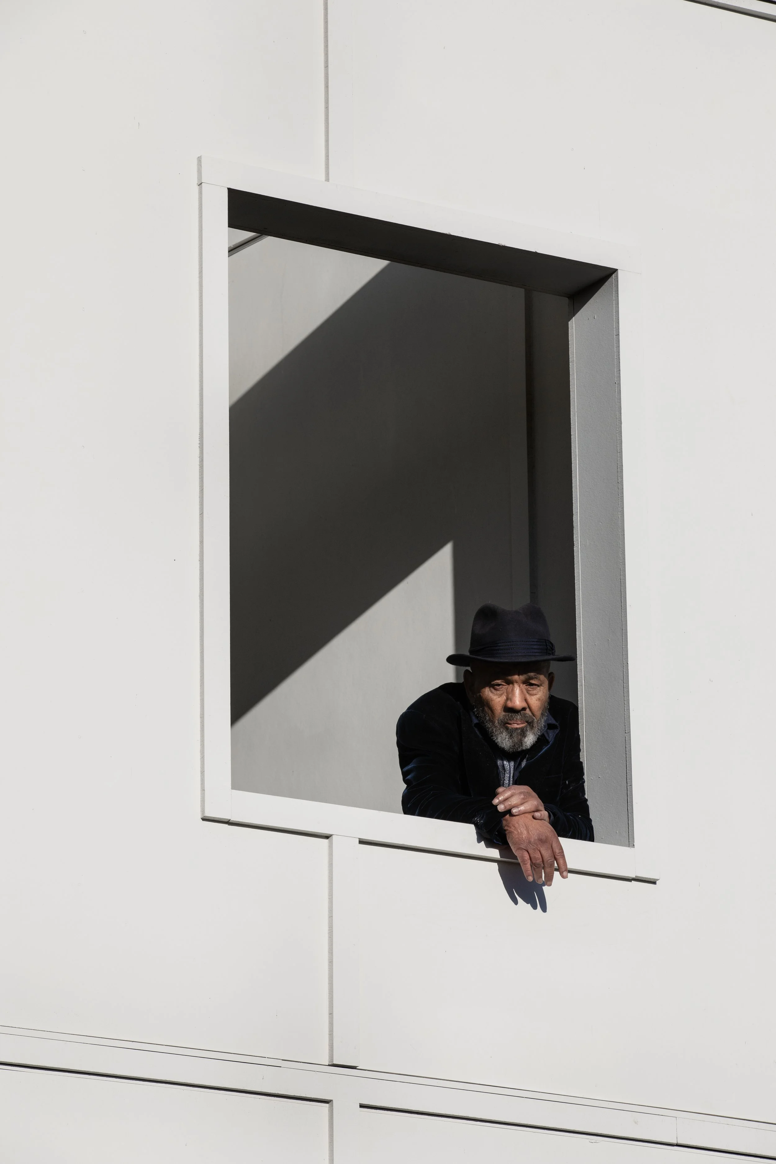 Man watching us skate from window.JPG