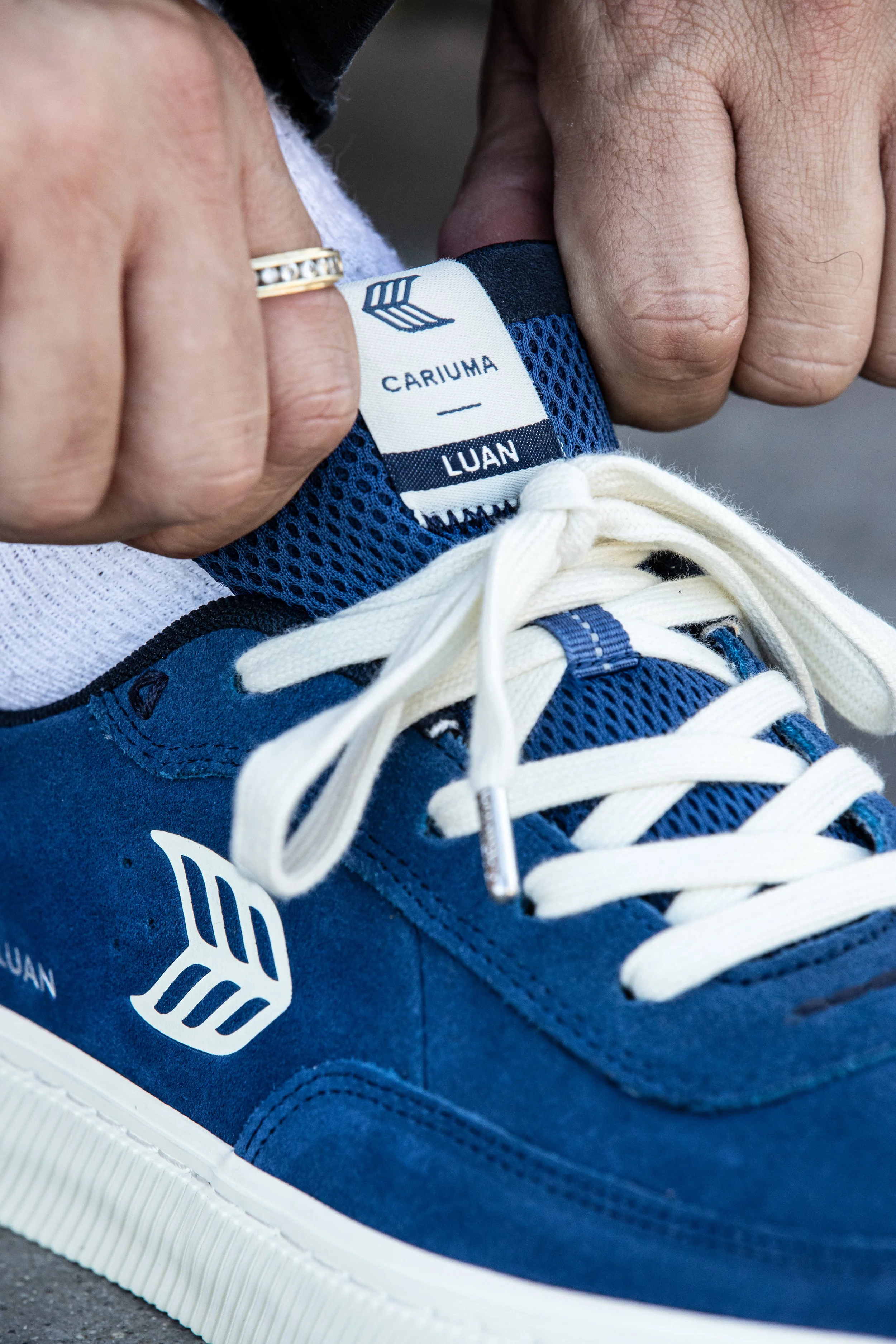 Luan holding blue white shoe portrait 2 (RE-EDIT).jpg
