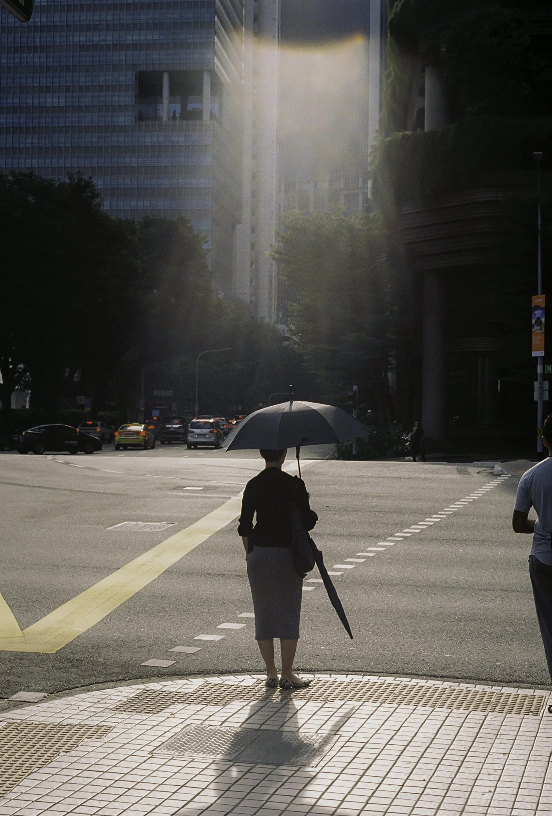Woman walking with umbrella 2.JPG
