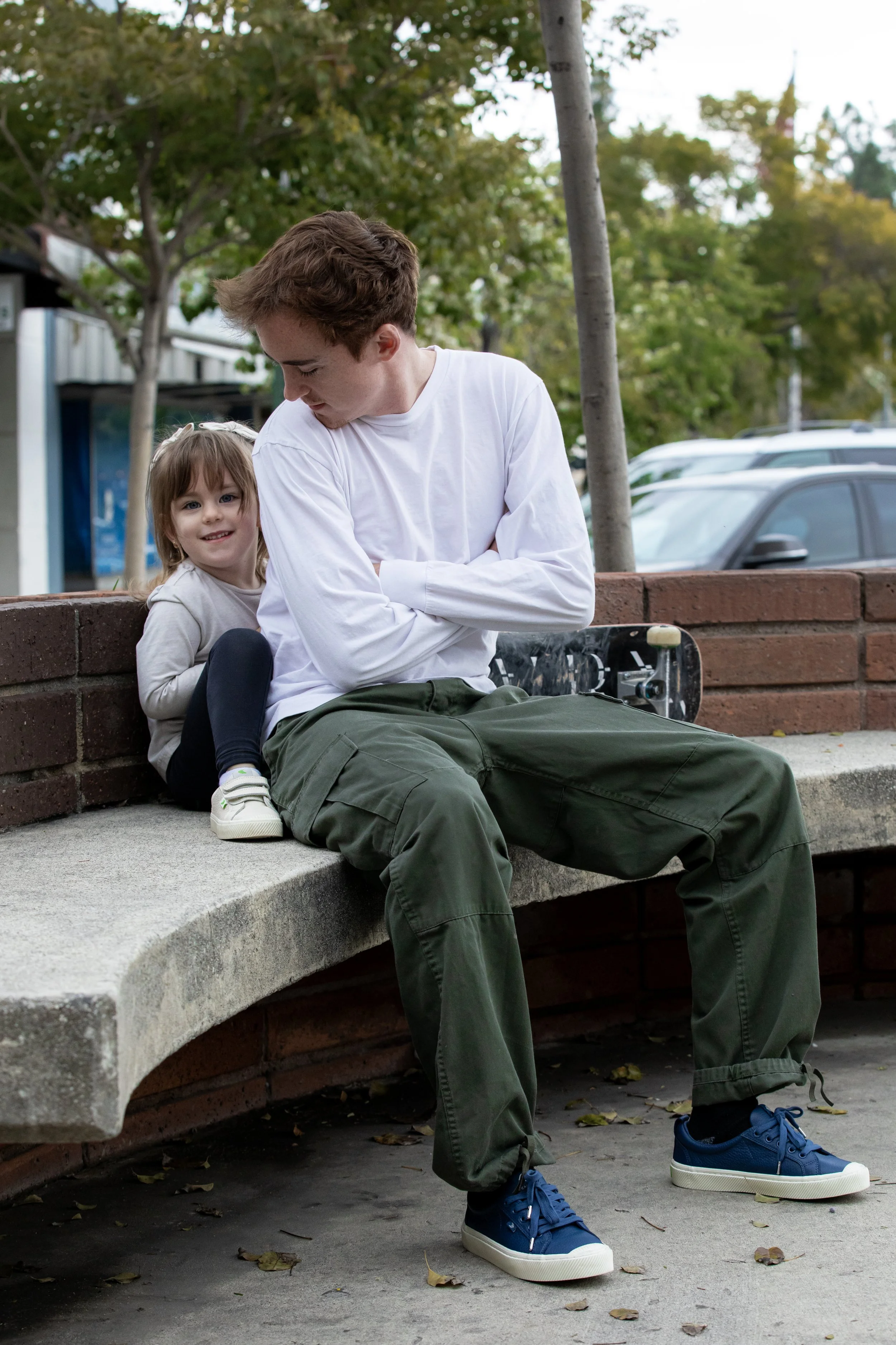 Tyler & Emy sitting on bench 1 copy.JPG