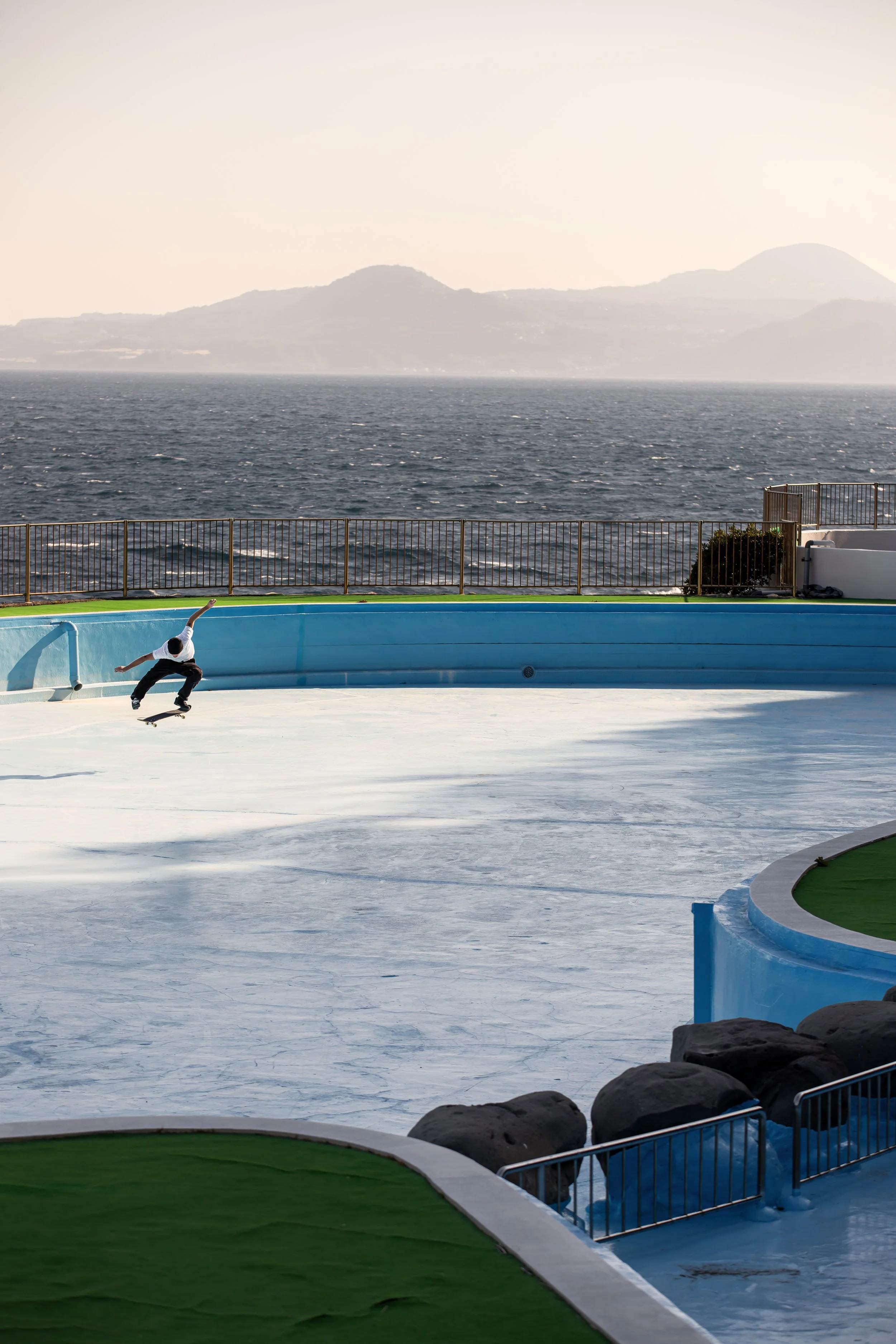 Tyler kickflip in empty pool (vertical).JPG