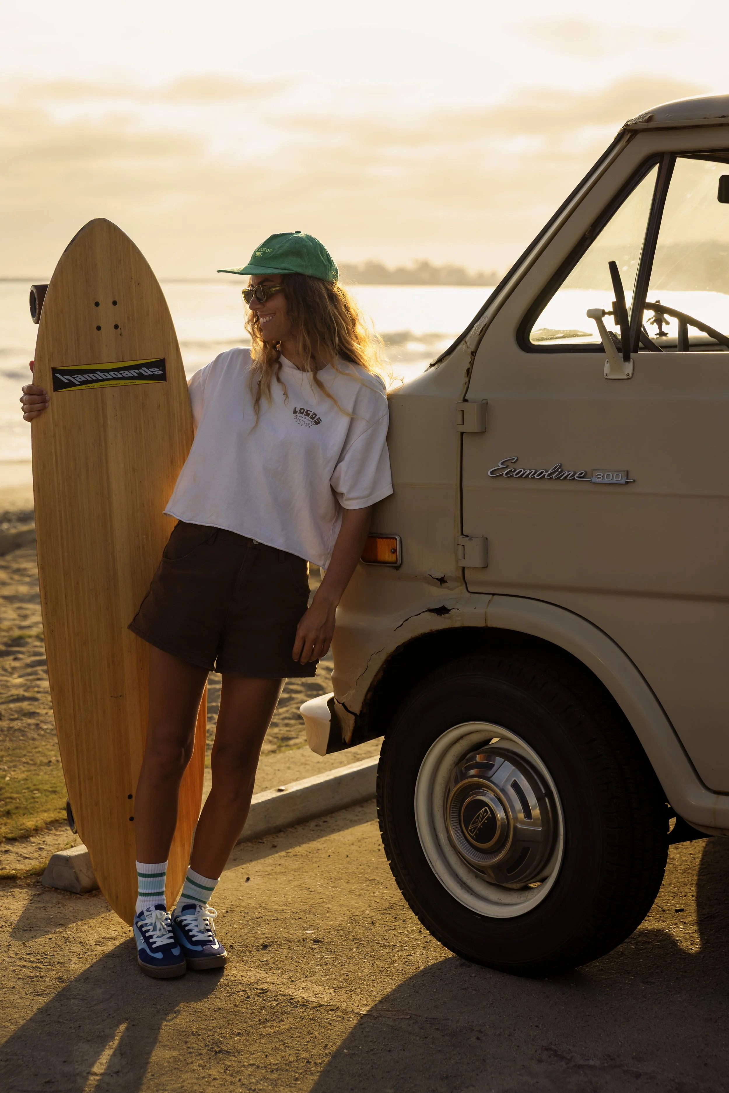 Louise portrait at beach with tall longboard.JPG