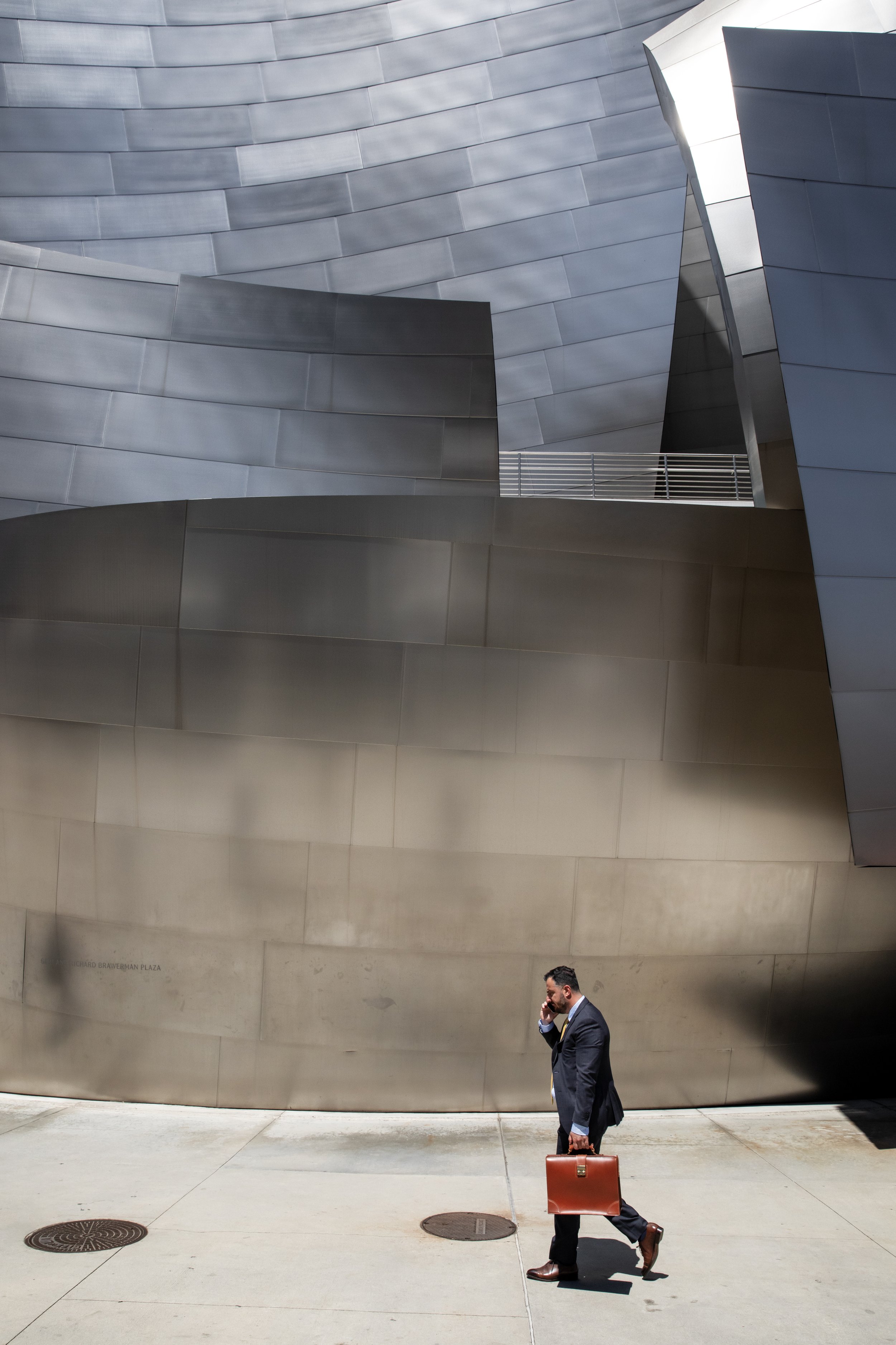 Man walking by Walt Disney Concert Hall.JPG