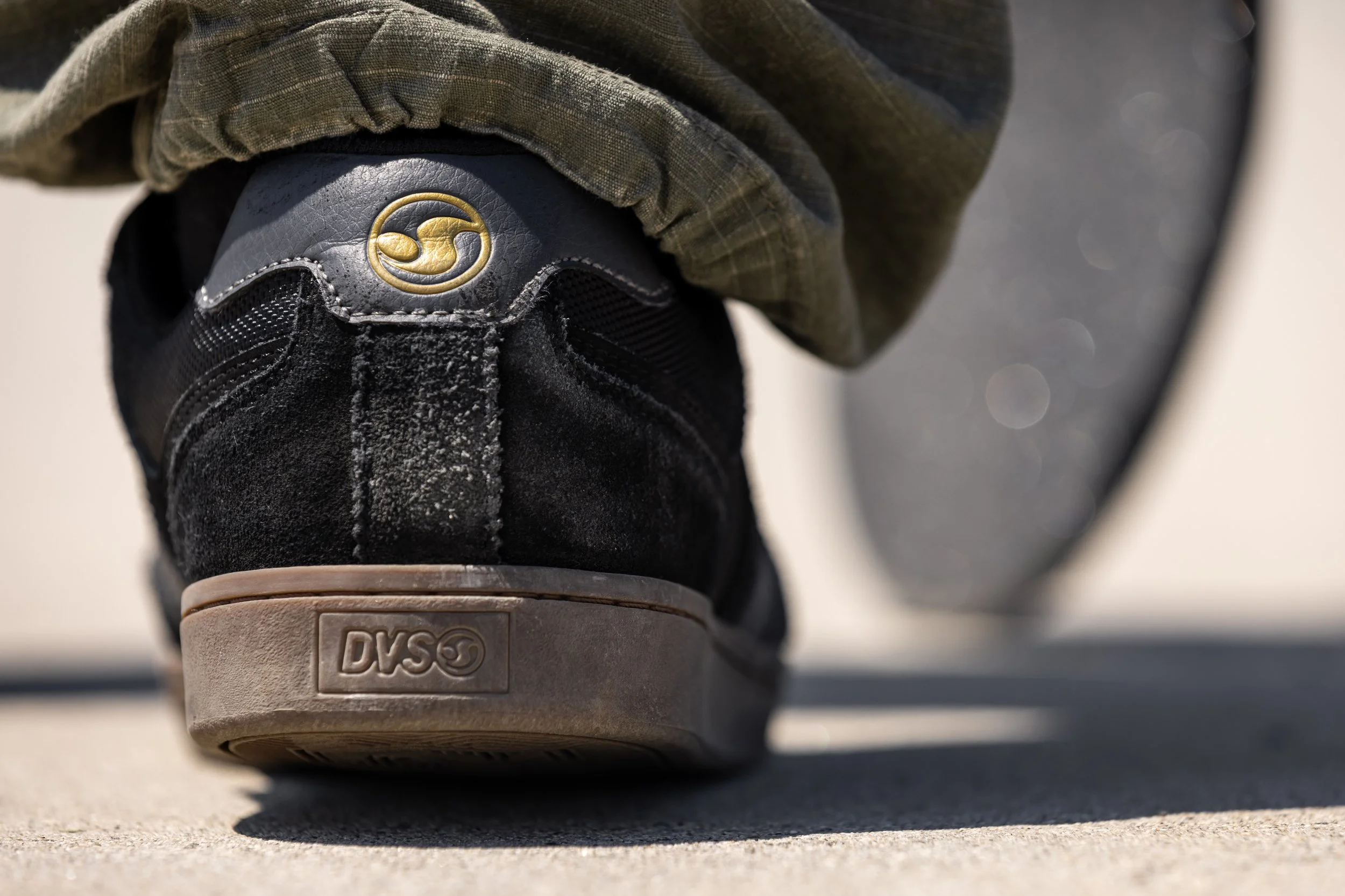 Levi wearing black:gum Milans at bank in dam spot product photo 1.JPG