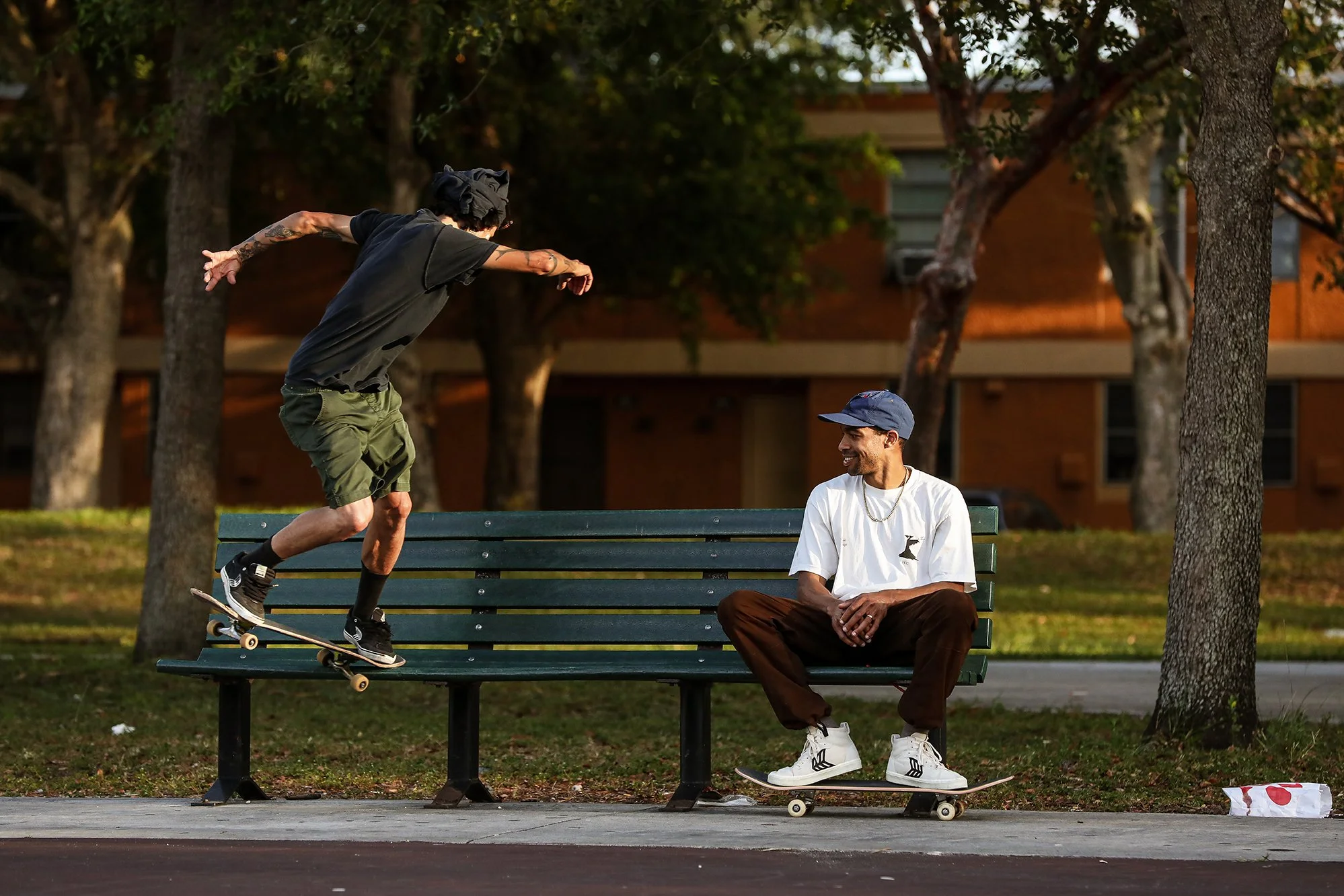 Trevor bs 180 nosegrind with Timmy on bench 1.jpg