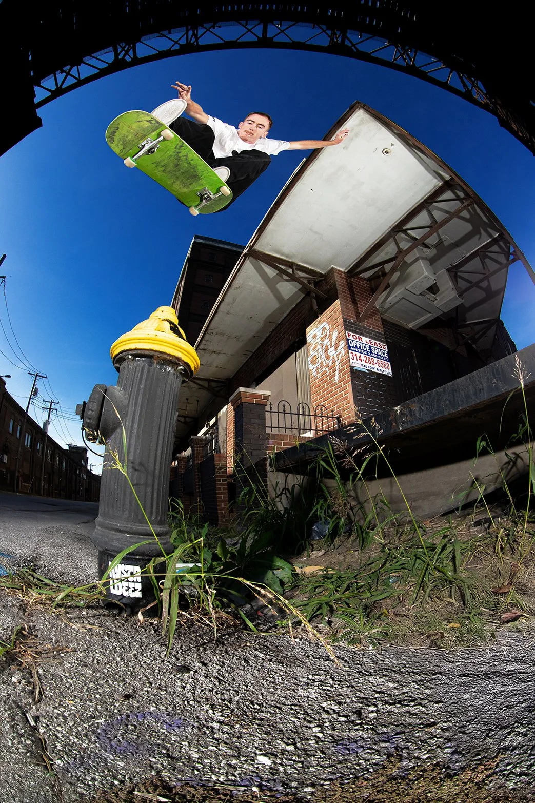 Tyler kickflip dock over hydrant.jpg