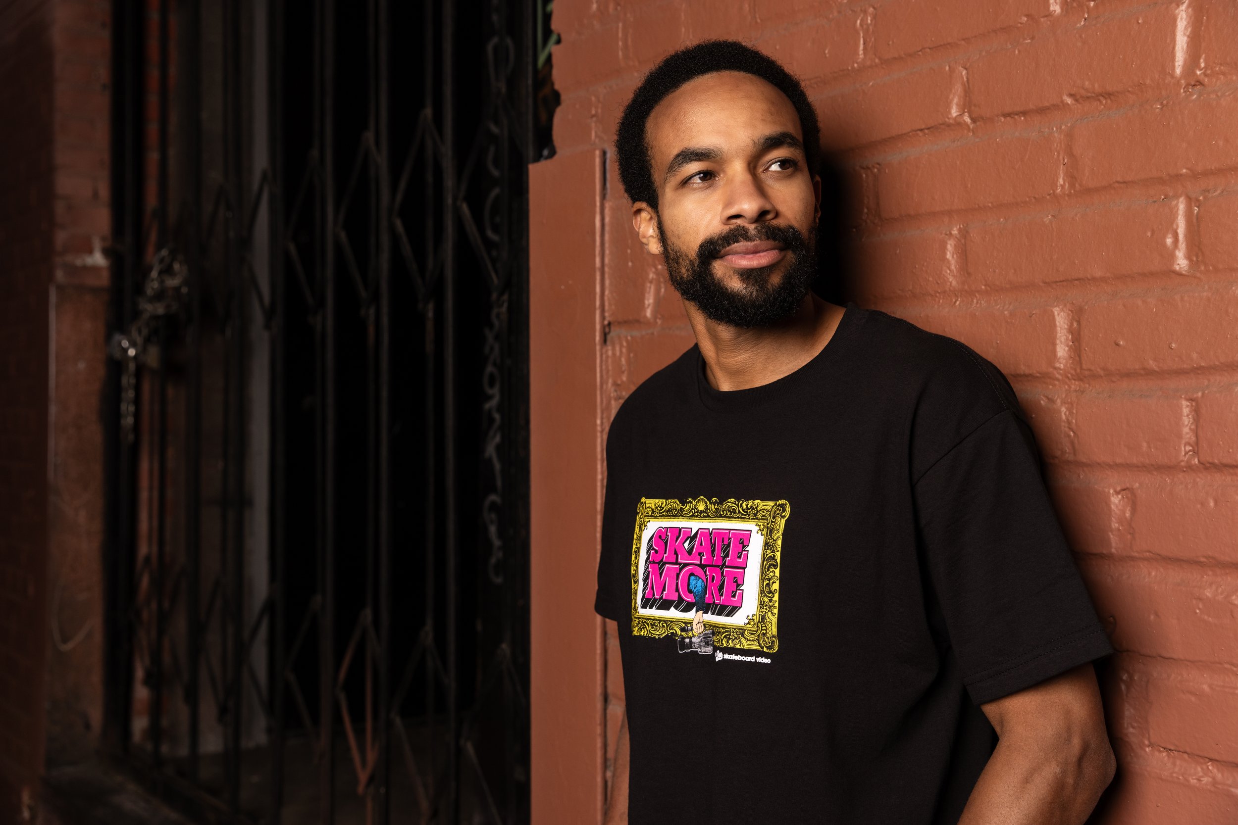 Timmy wearing SkateMore t-shirt portrait.JPG