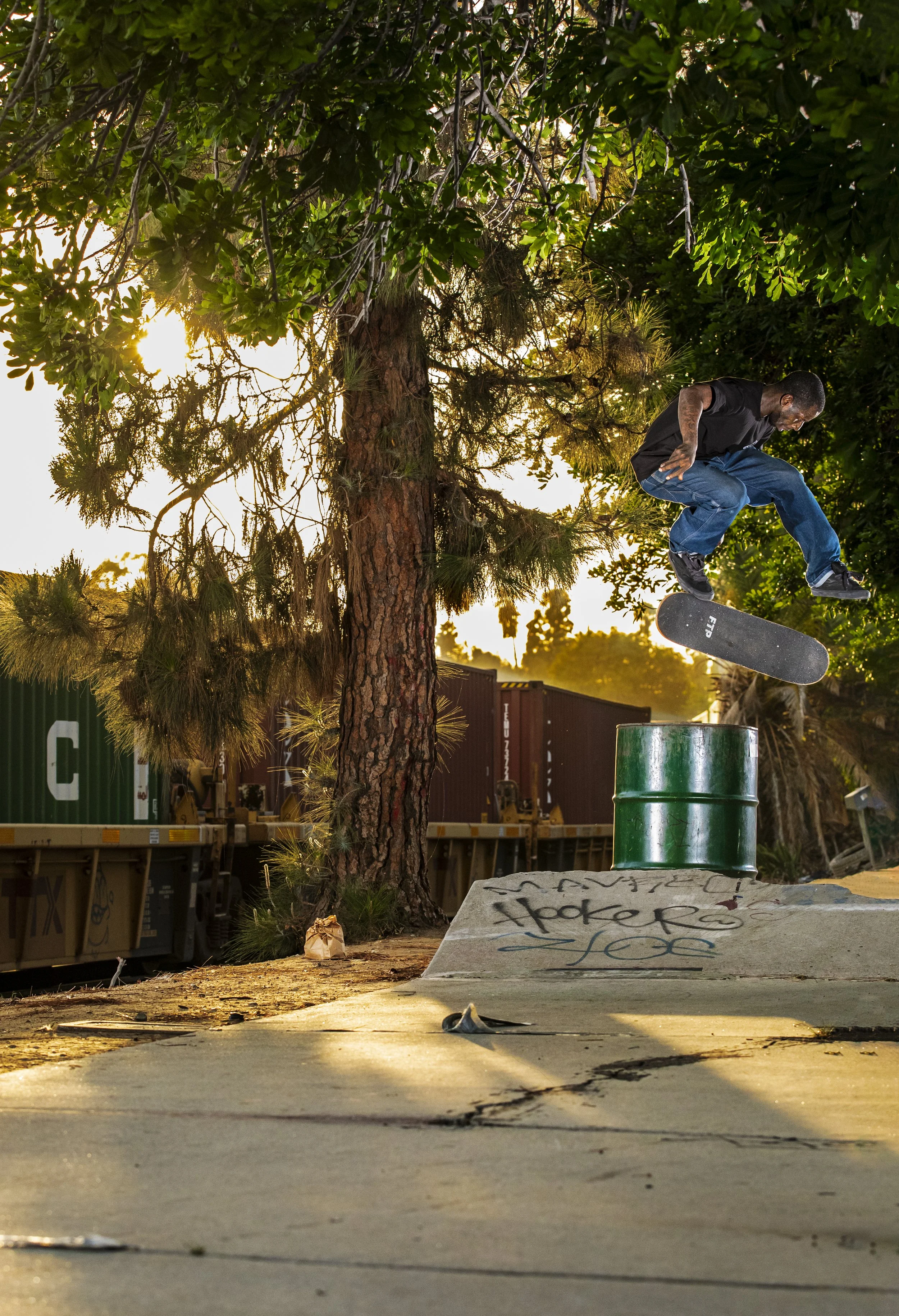 Antwuan shifty kickflip over trash can 2.JPG