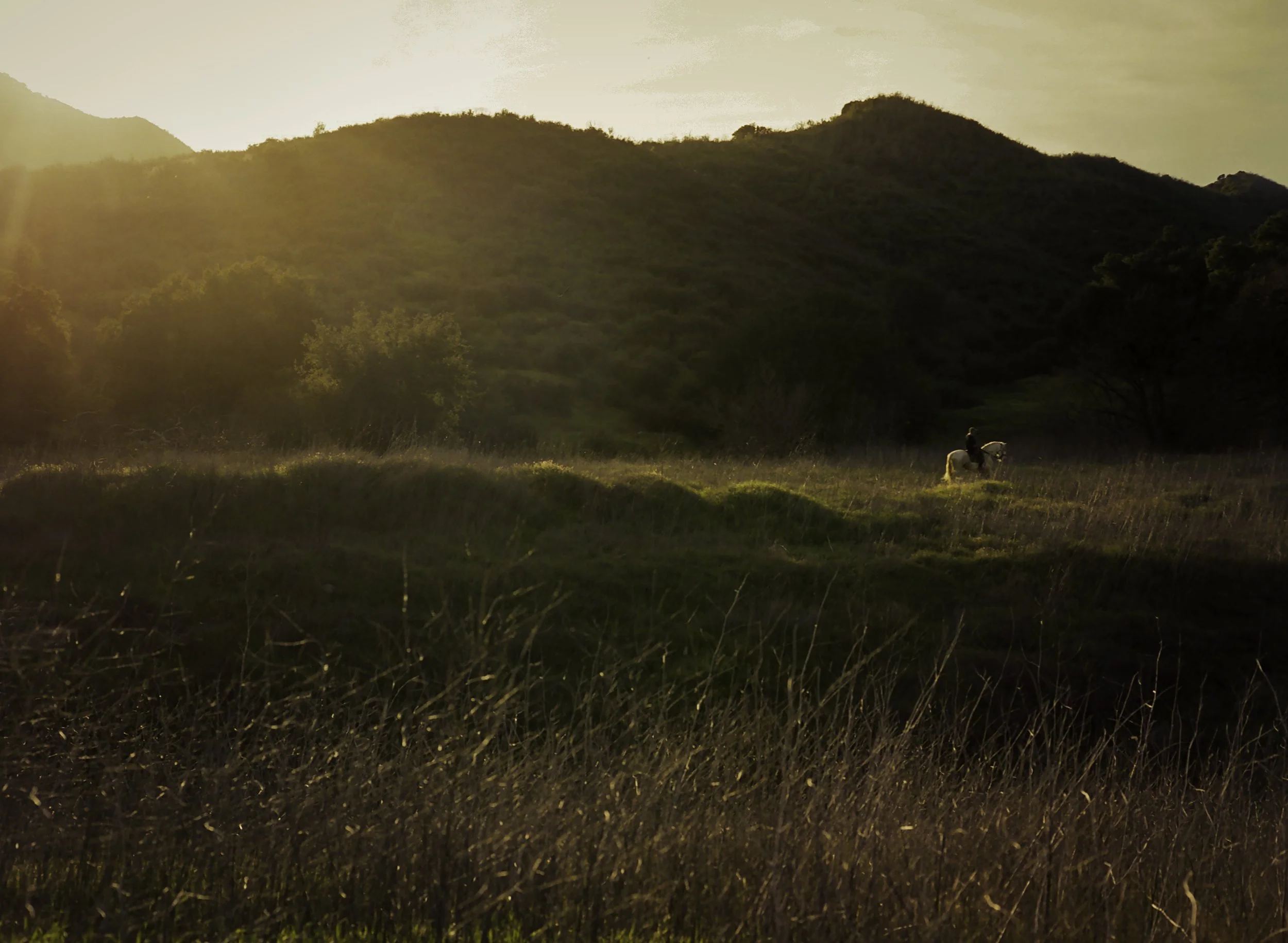 Man riding horse through Paramount Ranch.JPG