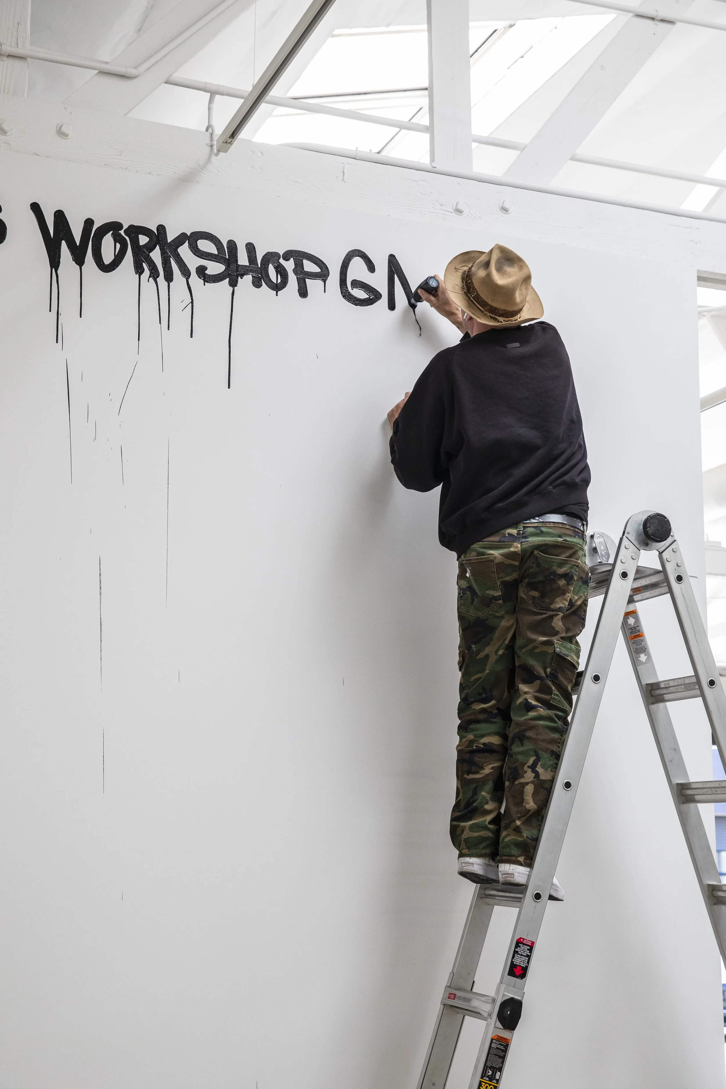 Danny signing collaboration wall 2.JPG