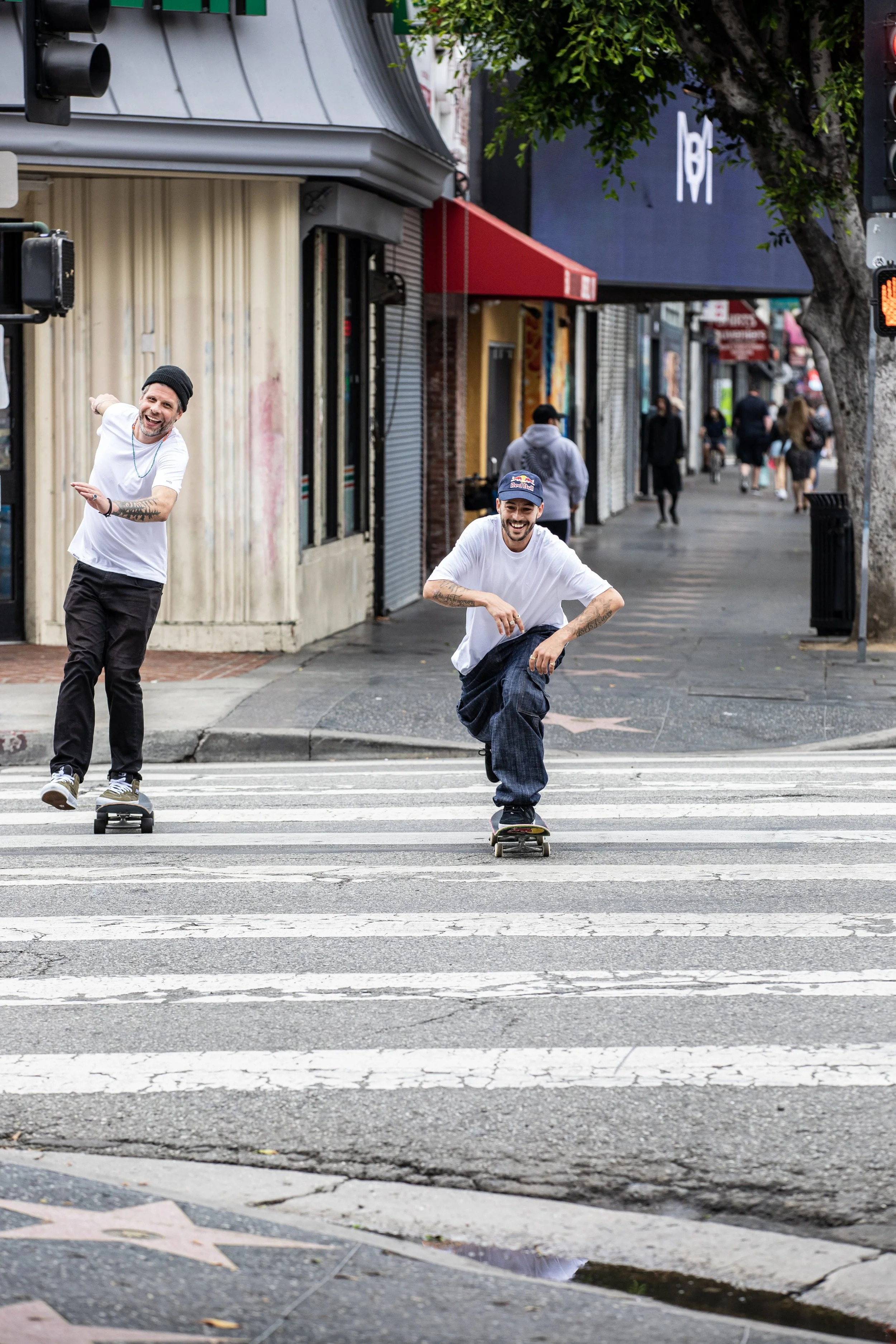 TJ & Dez pushing down Hollywood Blvd 2.JPG