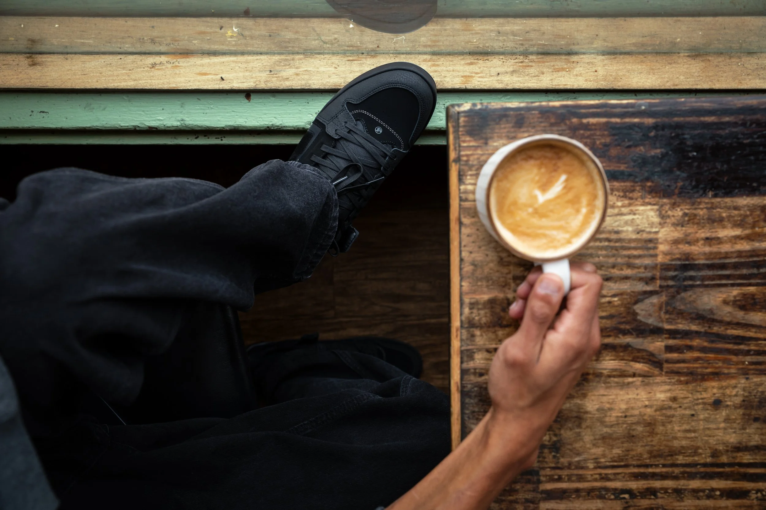 Timmy wearing all black Comanche LTs at coffee shop product photo 1.JPG