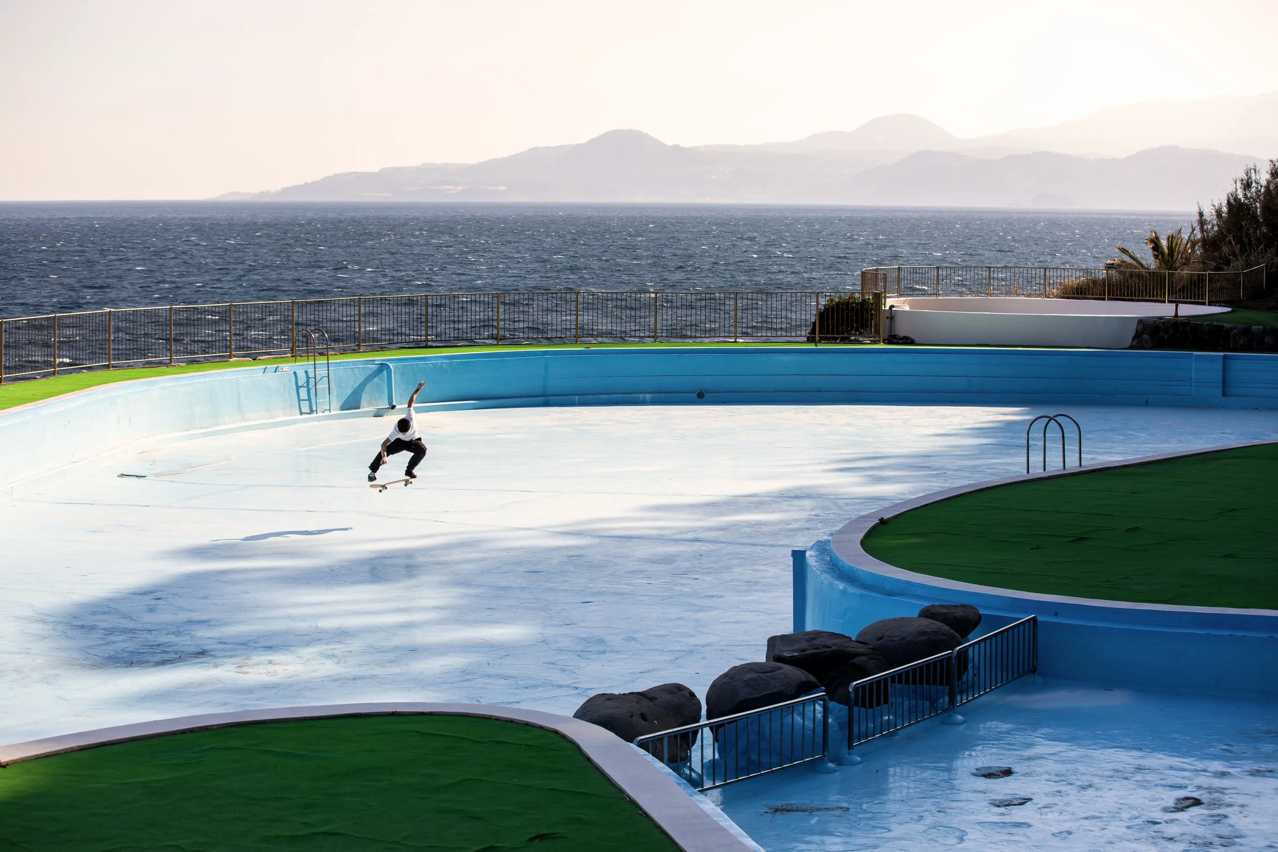 Tyler kickflip in empty pool (horizontal).JPG