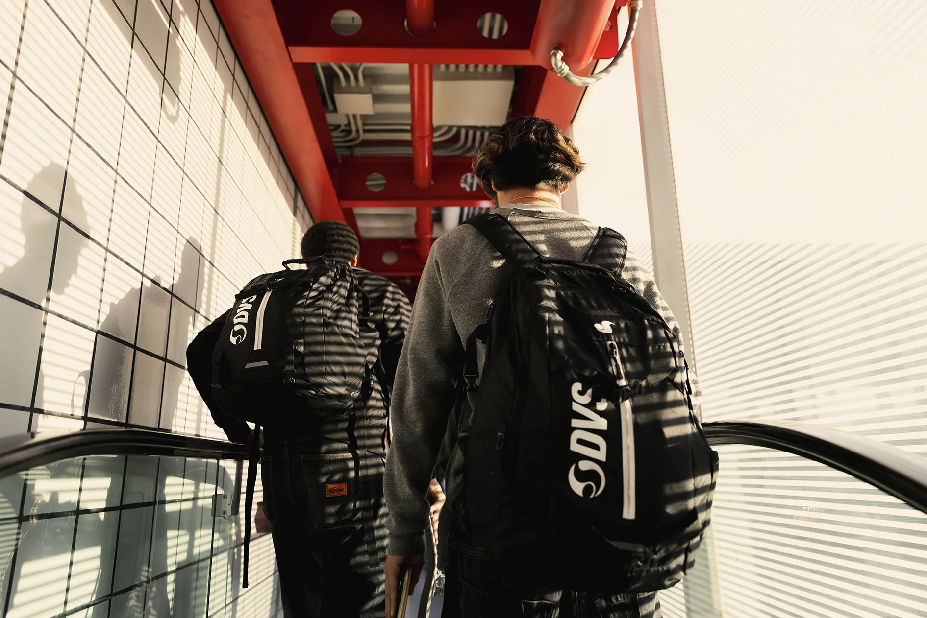 CANON_20260419_STEVEN & TIMMY ON AIRPORT ESCALATOR.jpg