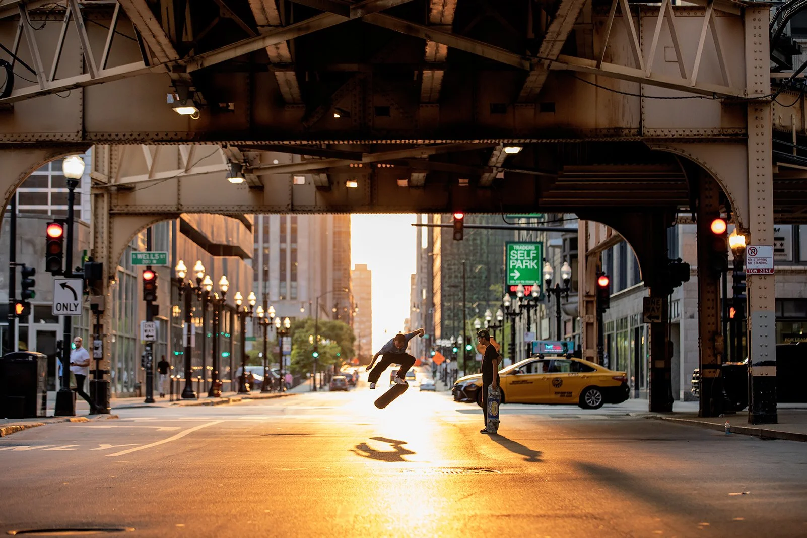 Tyler & Steven playing skate under bridge 2.jpg