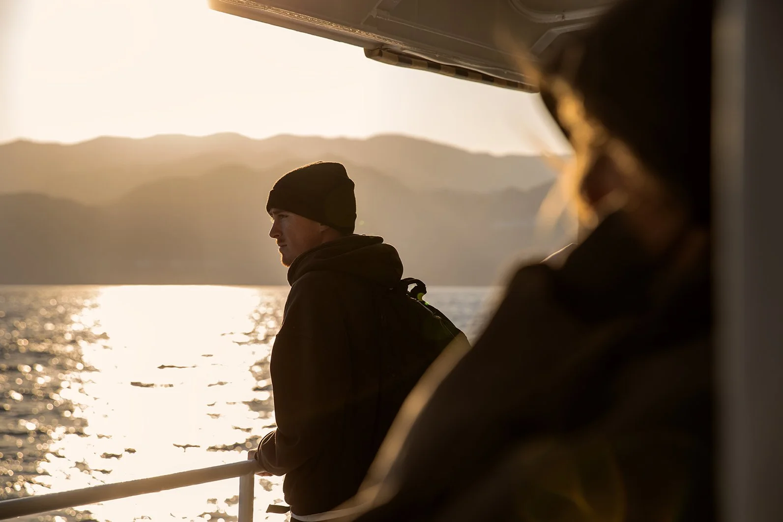 Tyler on boat looking out at ocean portrait 4.jpg