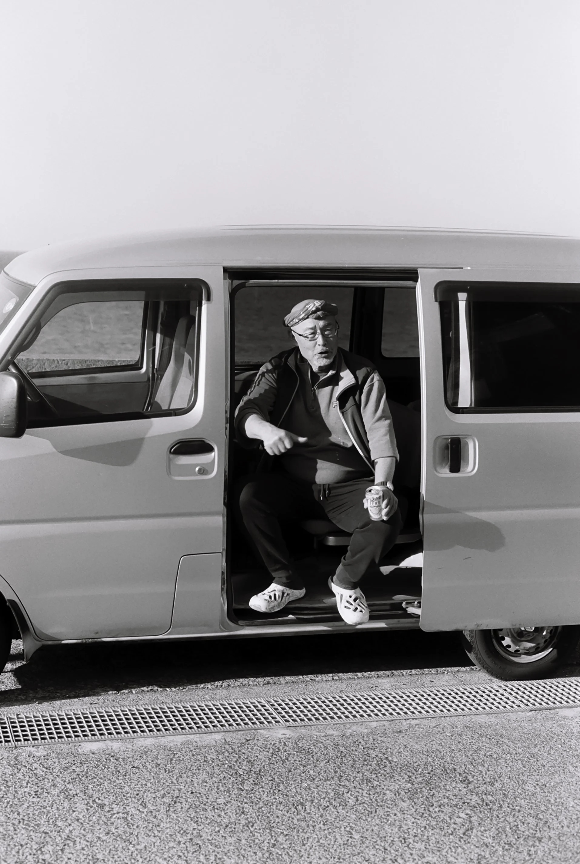 Guy sitting in his van on island.JPG