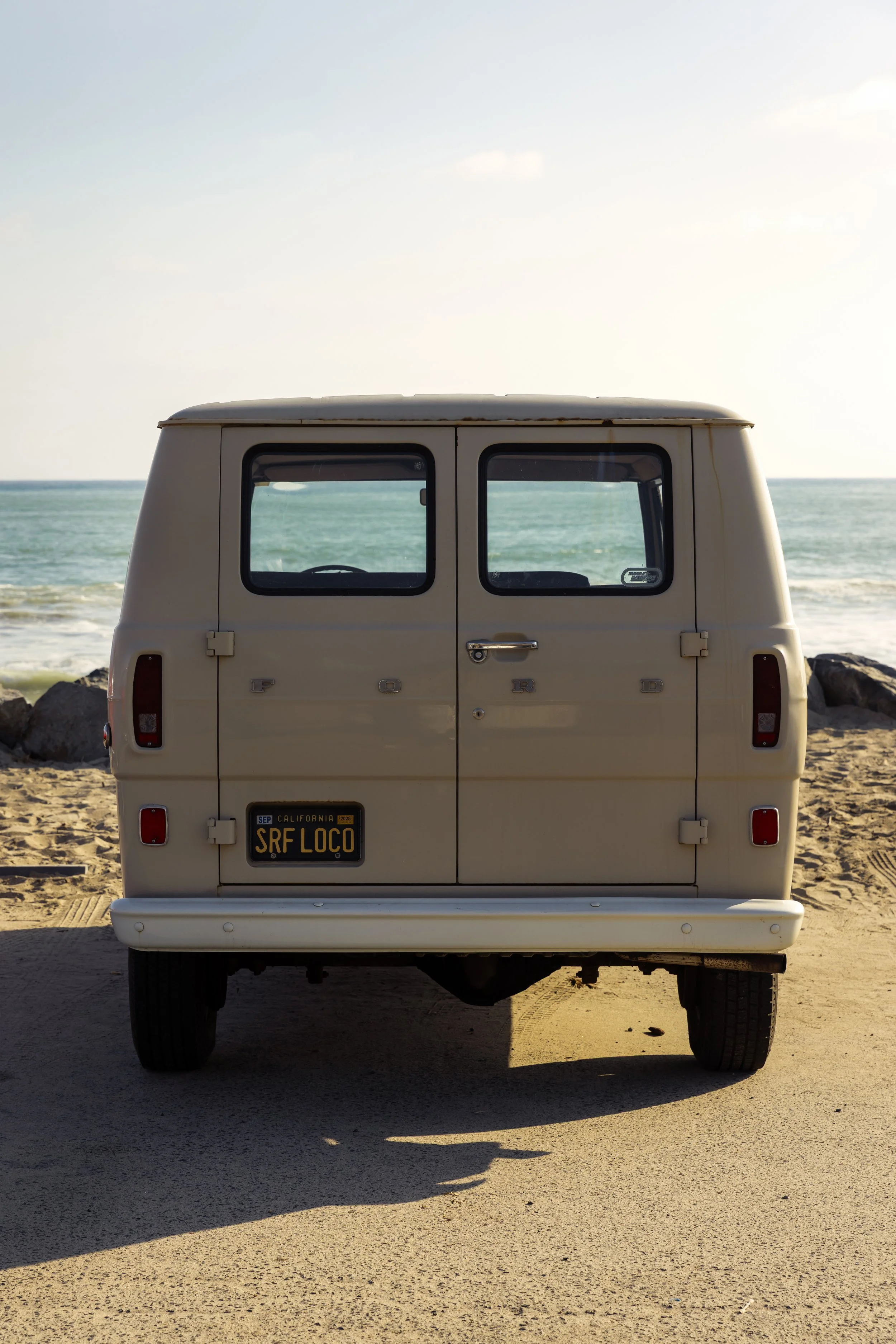 Louise's van in beach parking lot.JPG