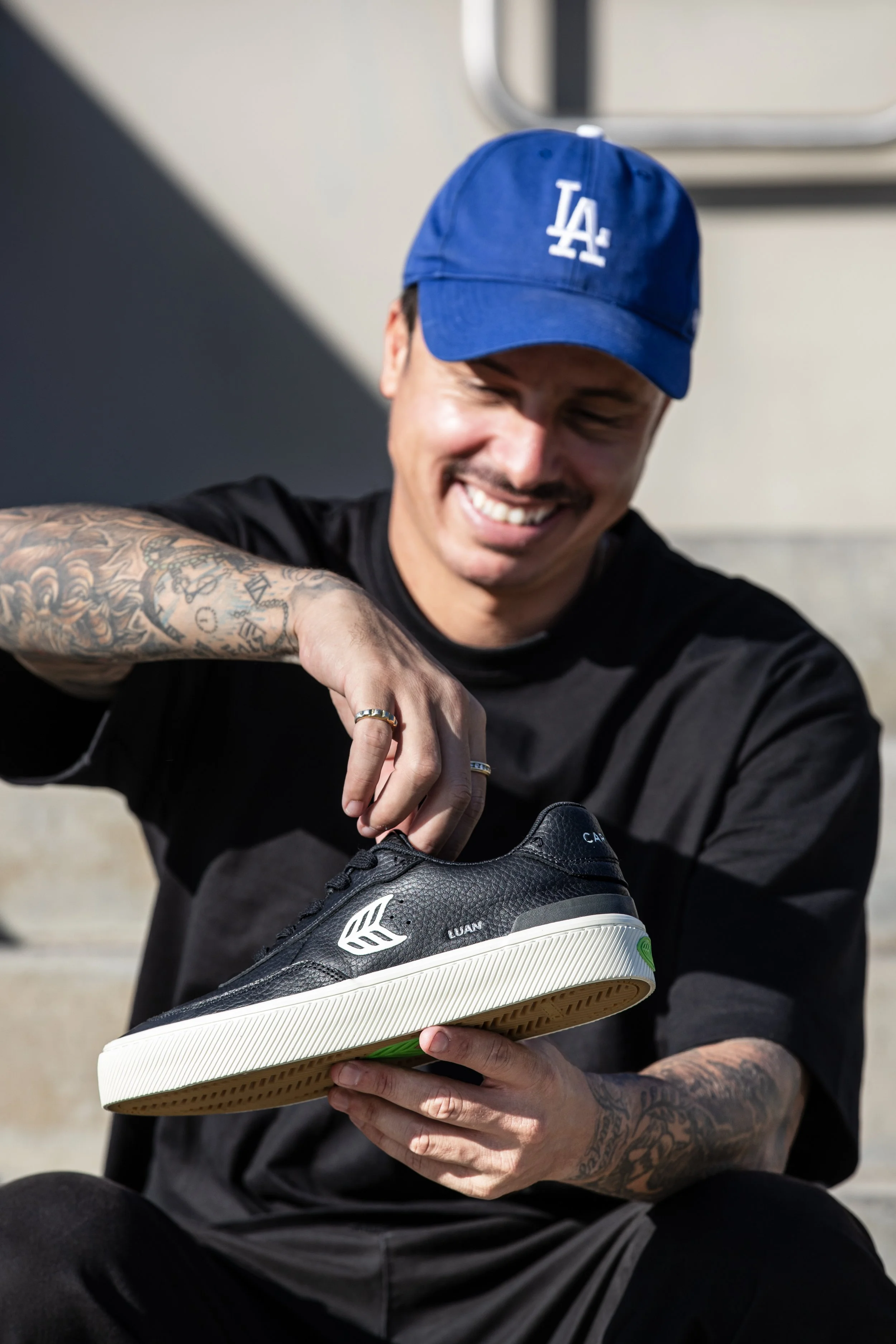 Luan holding black white shoe portrait 3 (RE-EDIT).JPG
