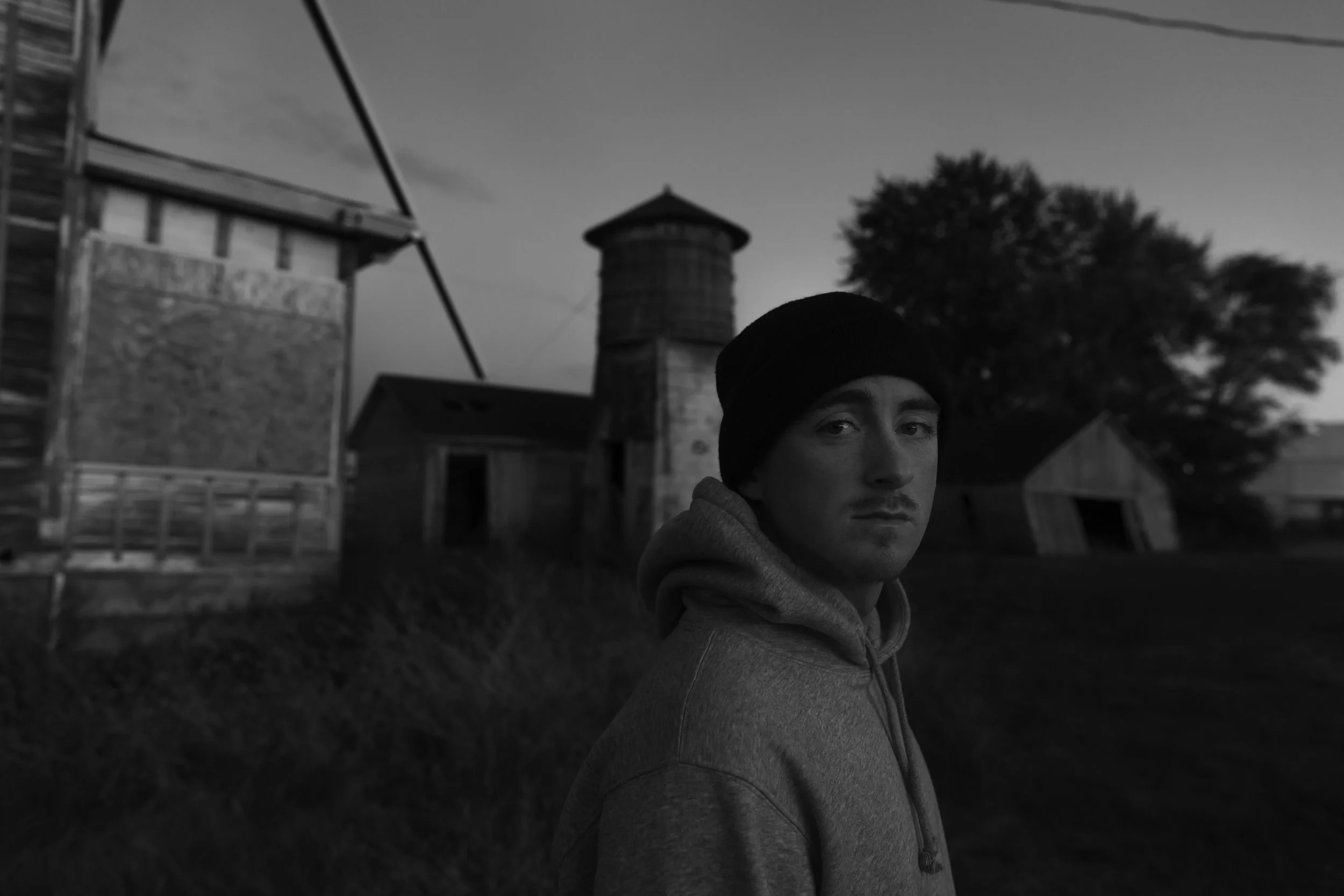 Tyler portrait in middle of abandoned farm 3.JPG