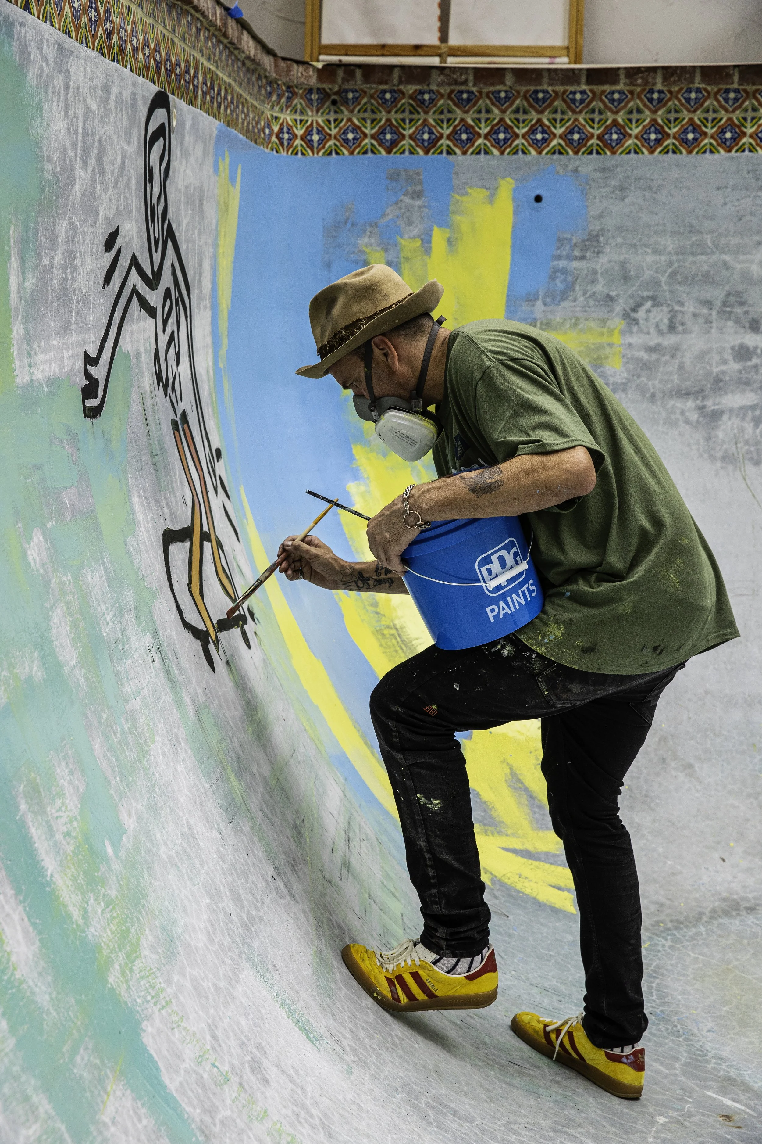Danny working on left wall painting.jpg