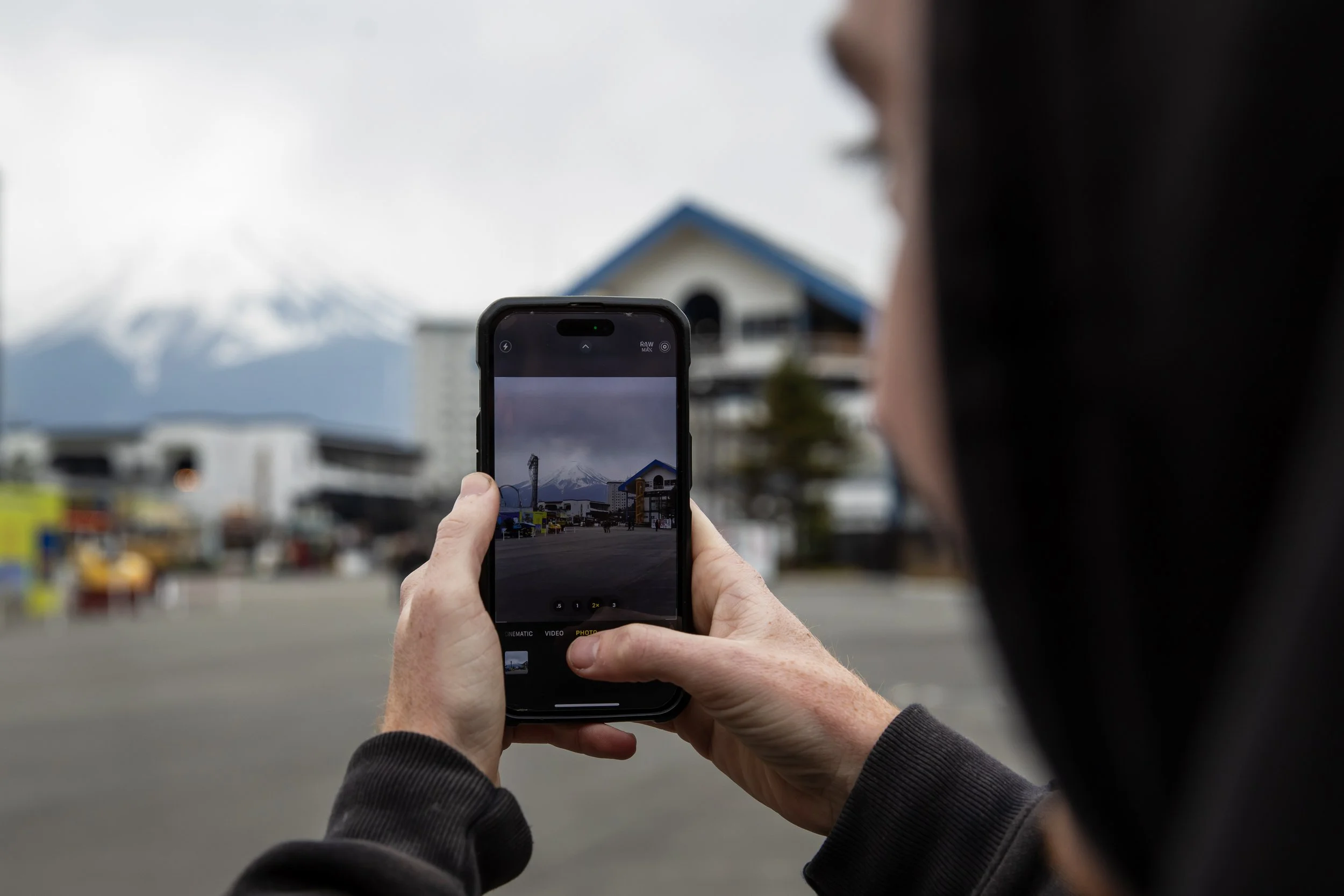 Tyler taking photo of Fuji-Q park.JPG