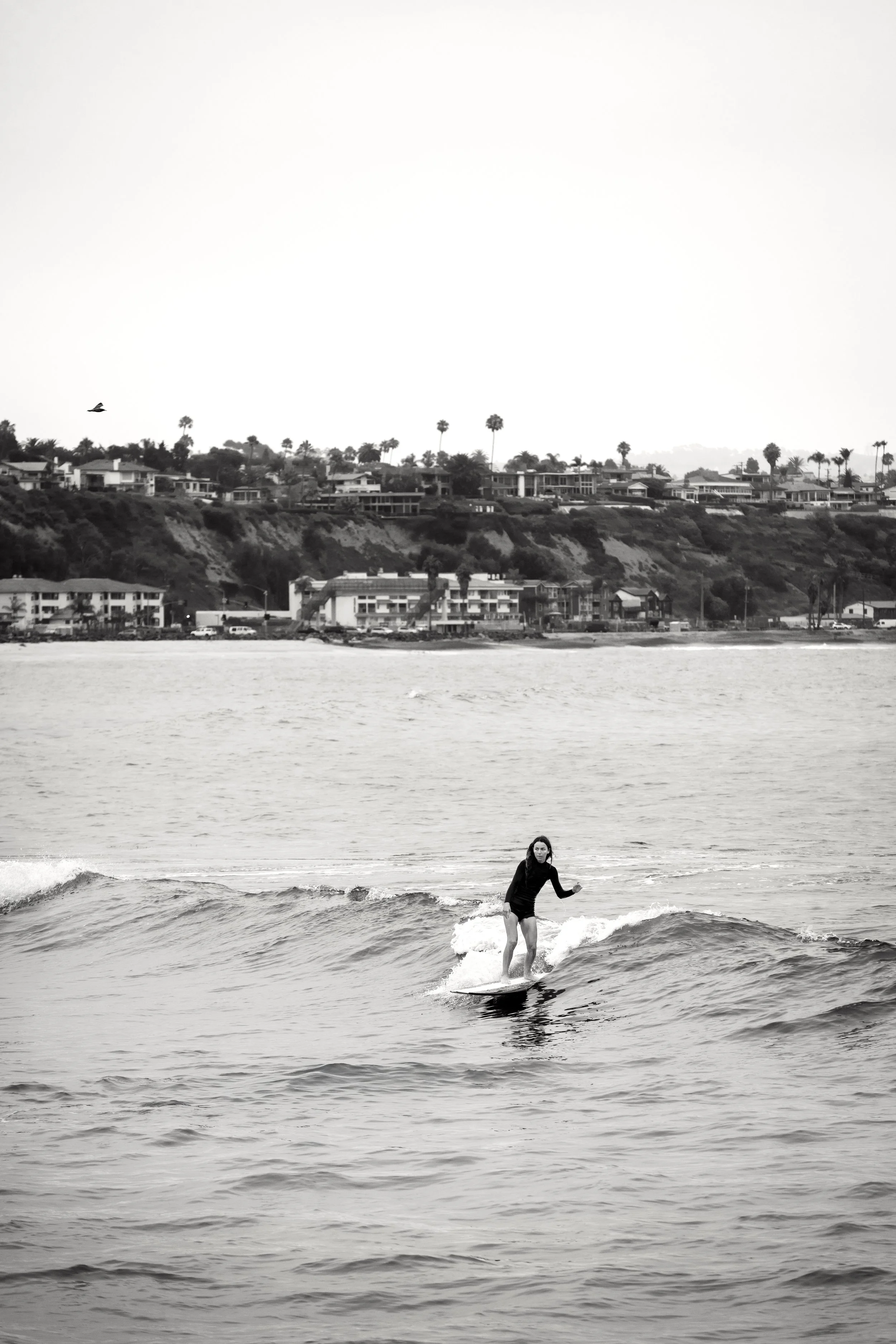 Louise surfing at beach.JPG