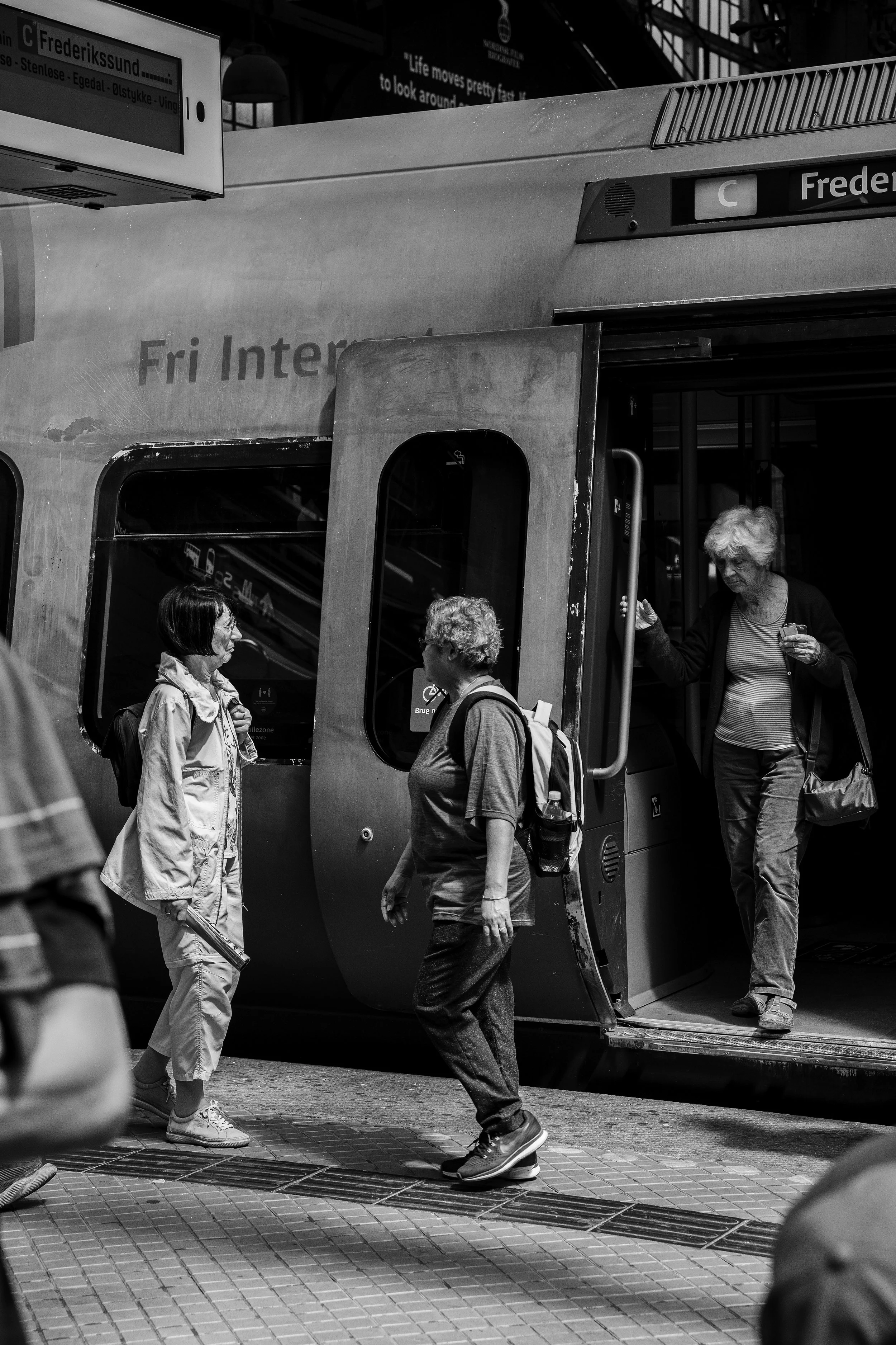 Pedestrians getting off of train.jpg