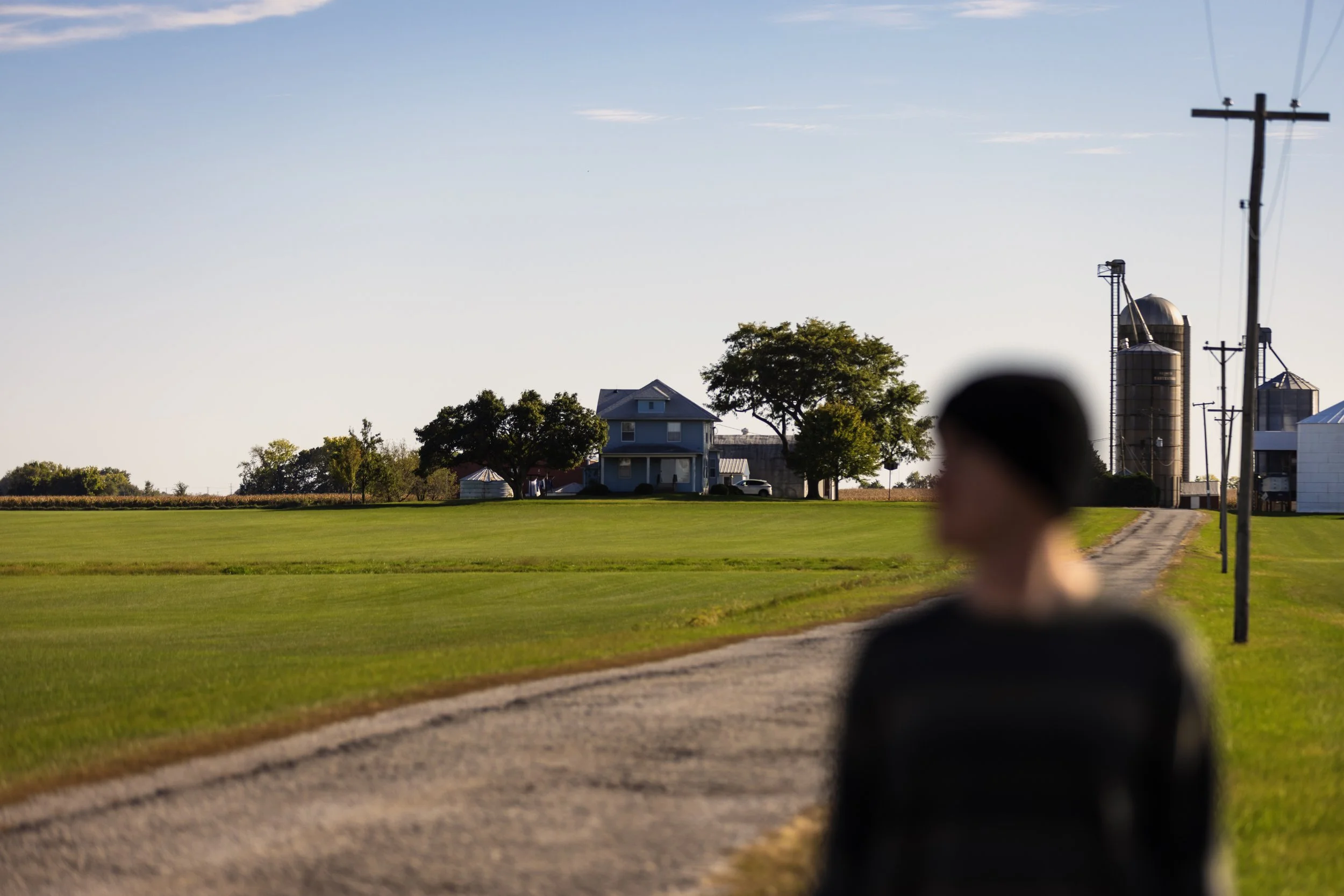 Tyler portrait in front of farm yard.JPG