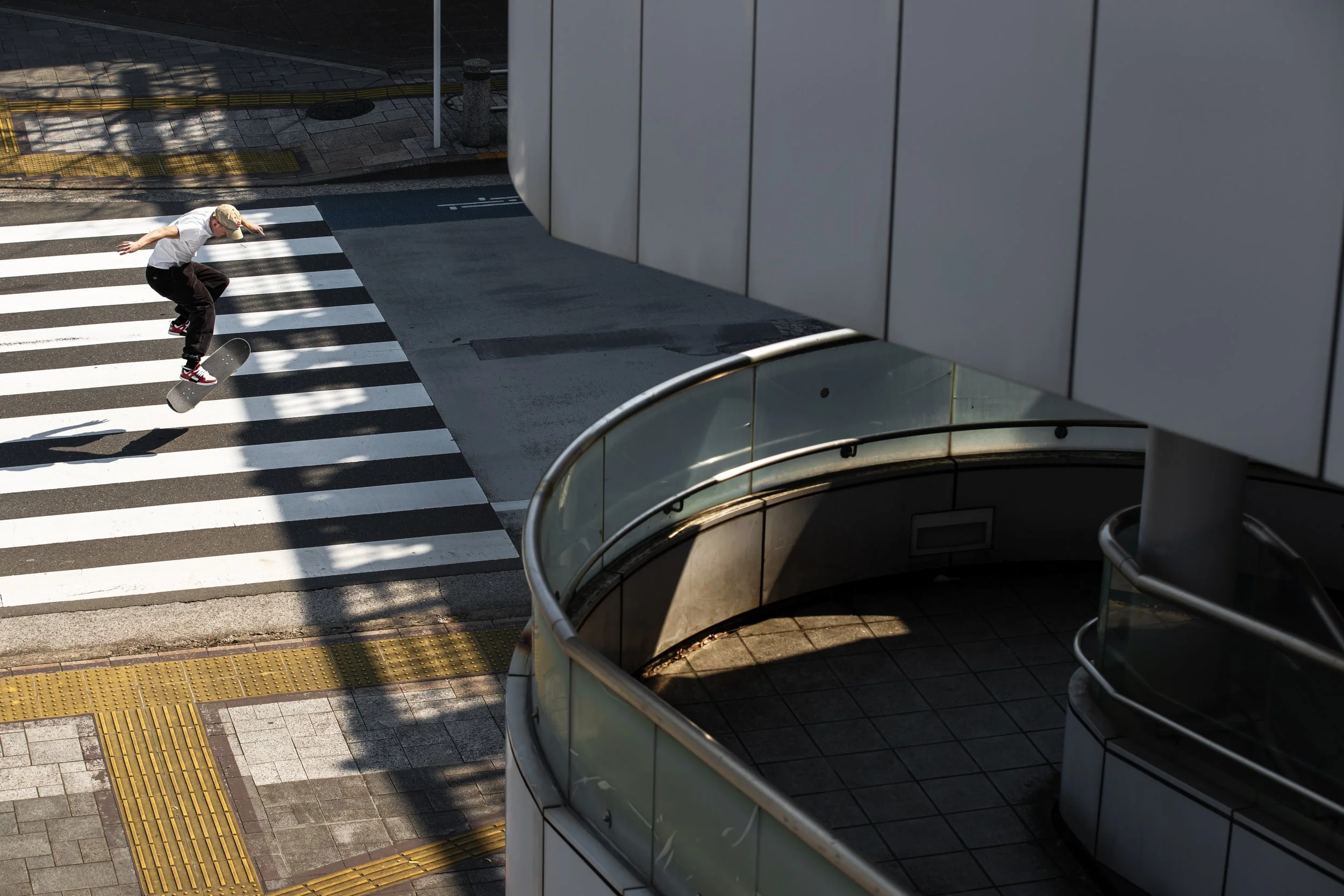 Tyler tre flip in crosswalk.JPG