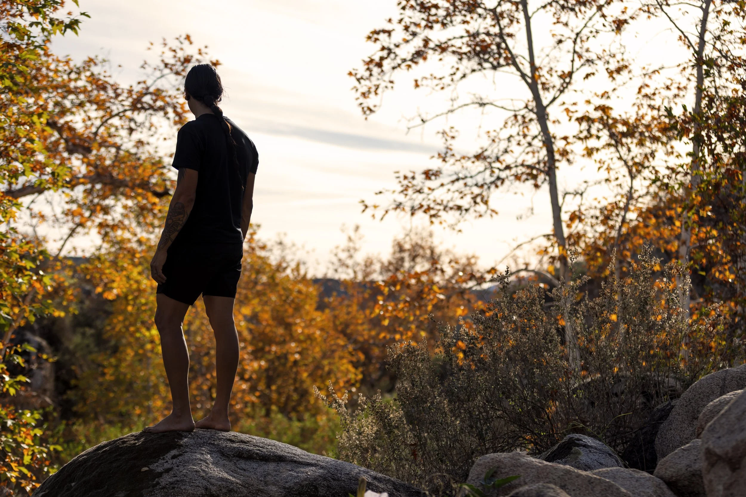 Ricky standing on rock looking at reservation (horizontal).JPG