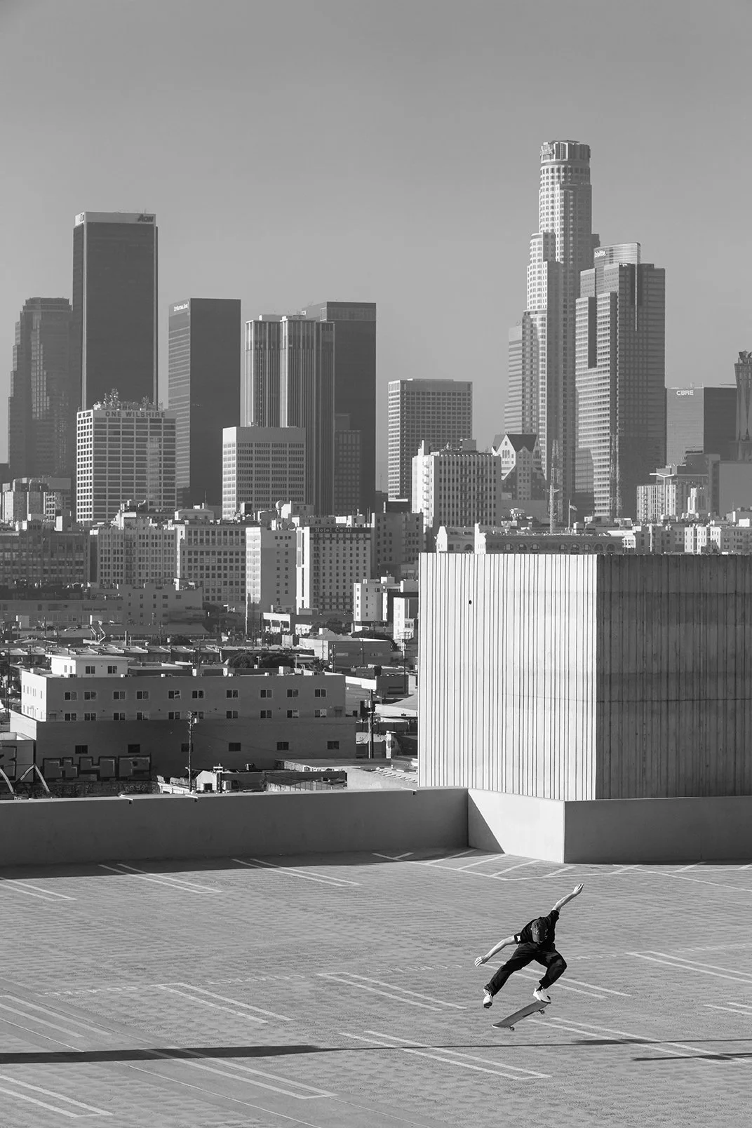 Tyler kickflip on roof (B&W).jpg