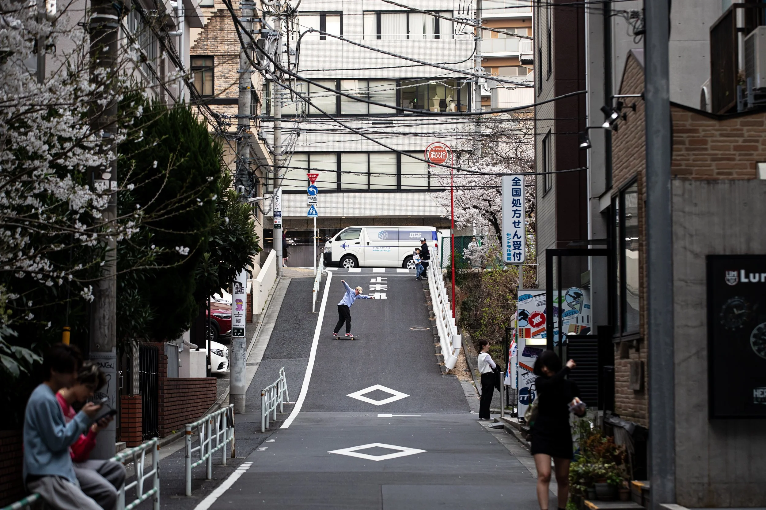 Tyler powerslide down hill in Harujuku.JPG