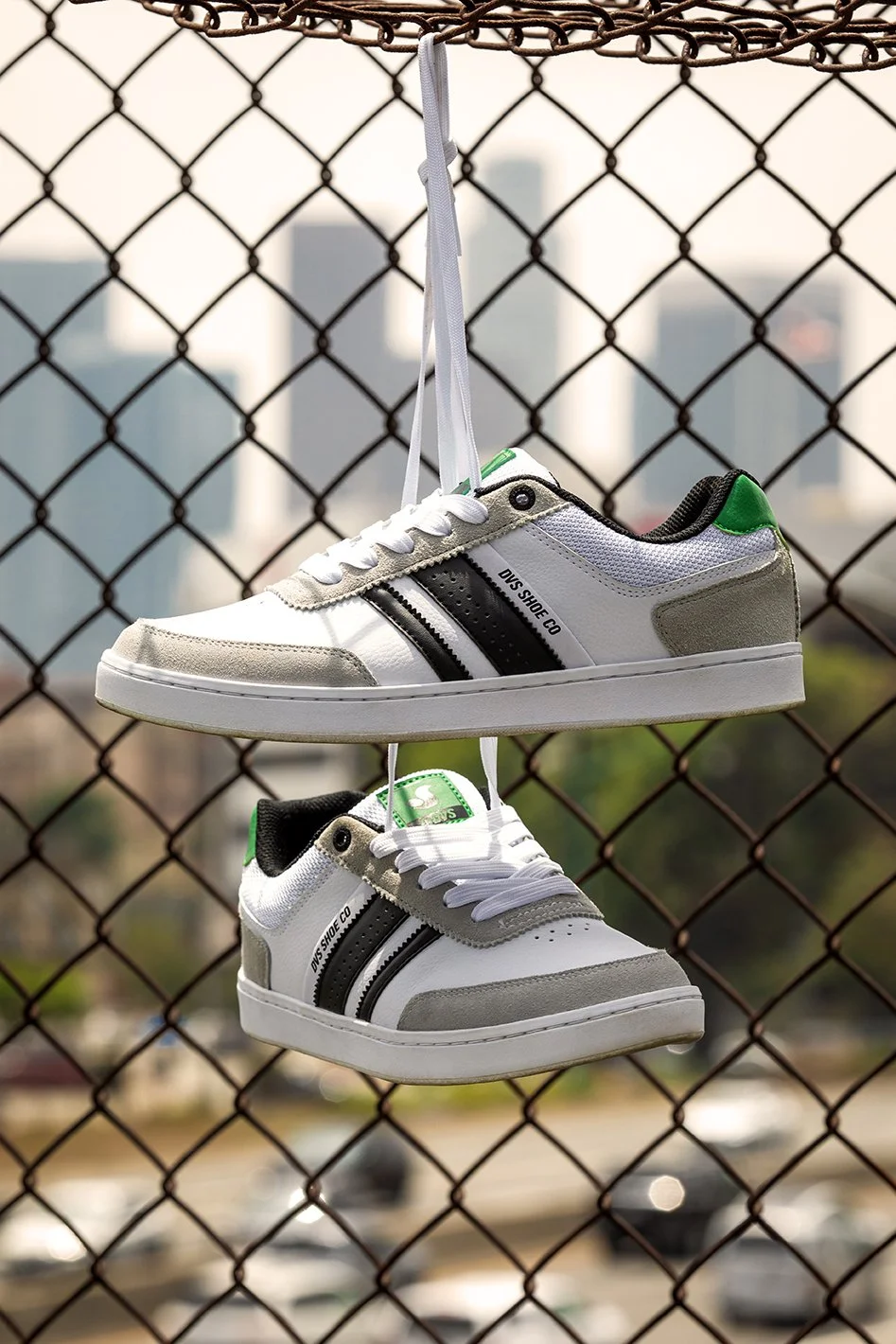 White-green milans product photo hanging from fence.jpg
