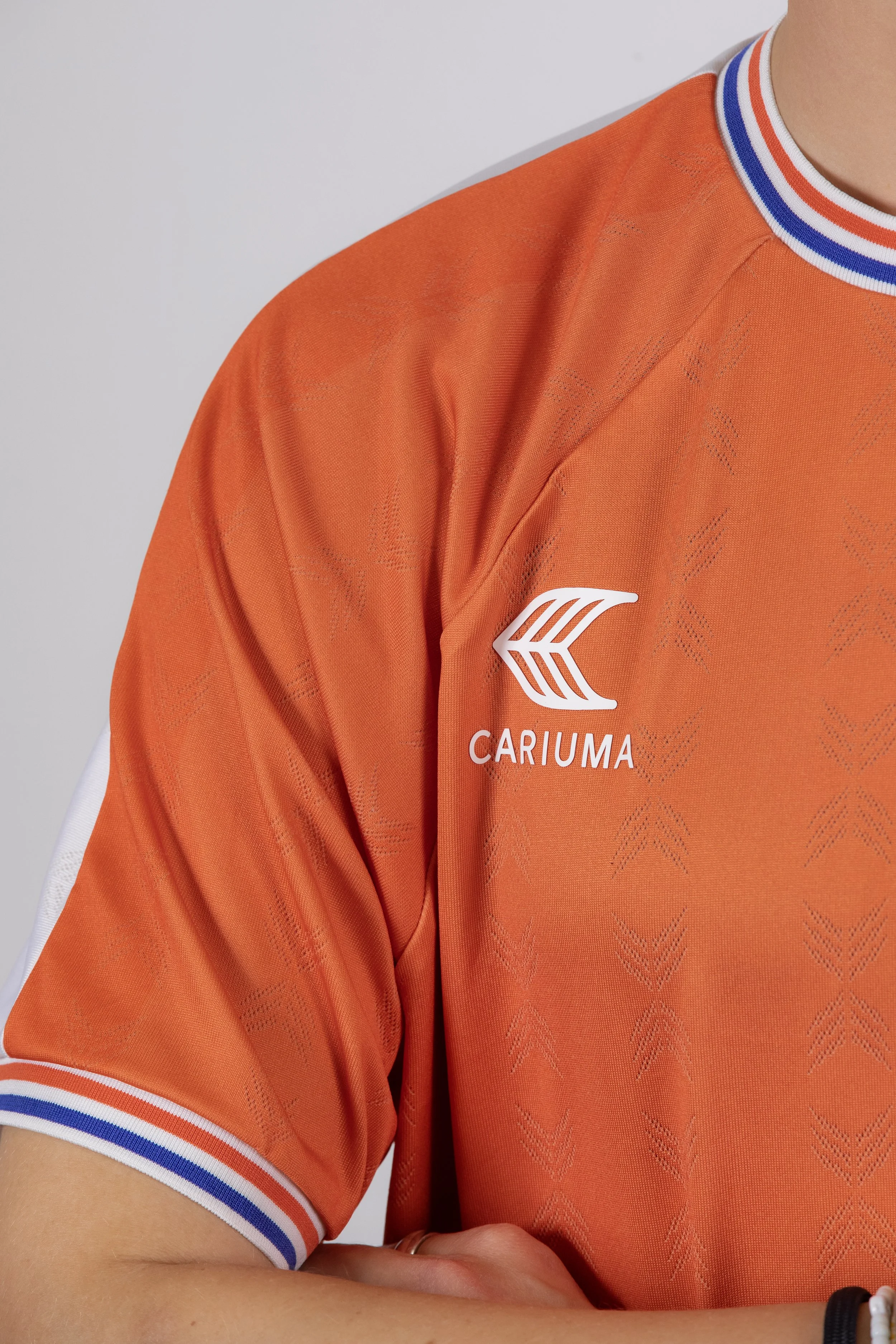 Roos wearing orange jersey close up 2.jpg