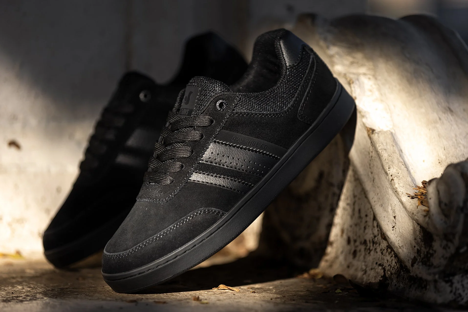 Black-black milans product photo on bench 1.jpg