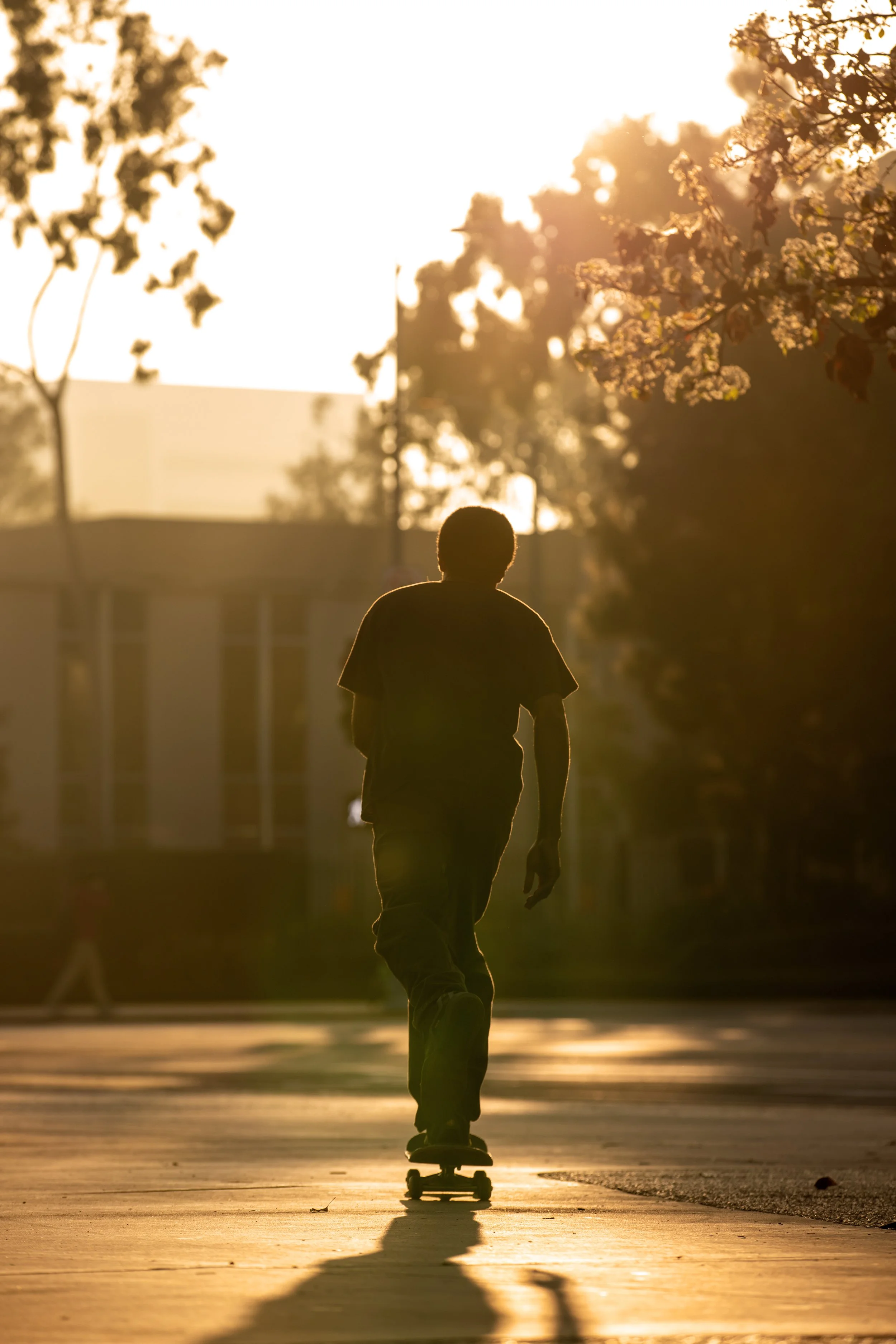 Timmy pushing through school at sunset.JPG