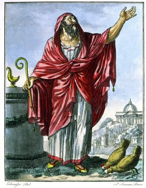 A man dressed in a flowing red robe, raising his right hand as if speaking or blessing. He is standing outdoors on a balcony or terrace with a cityscape and a domed building in the background, and two birds on the ground nearby.